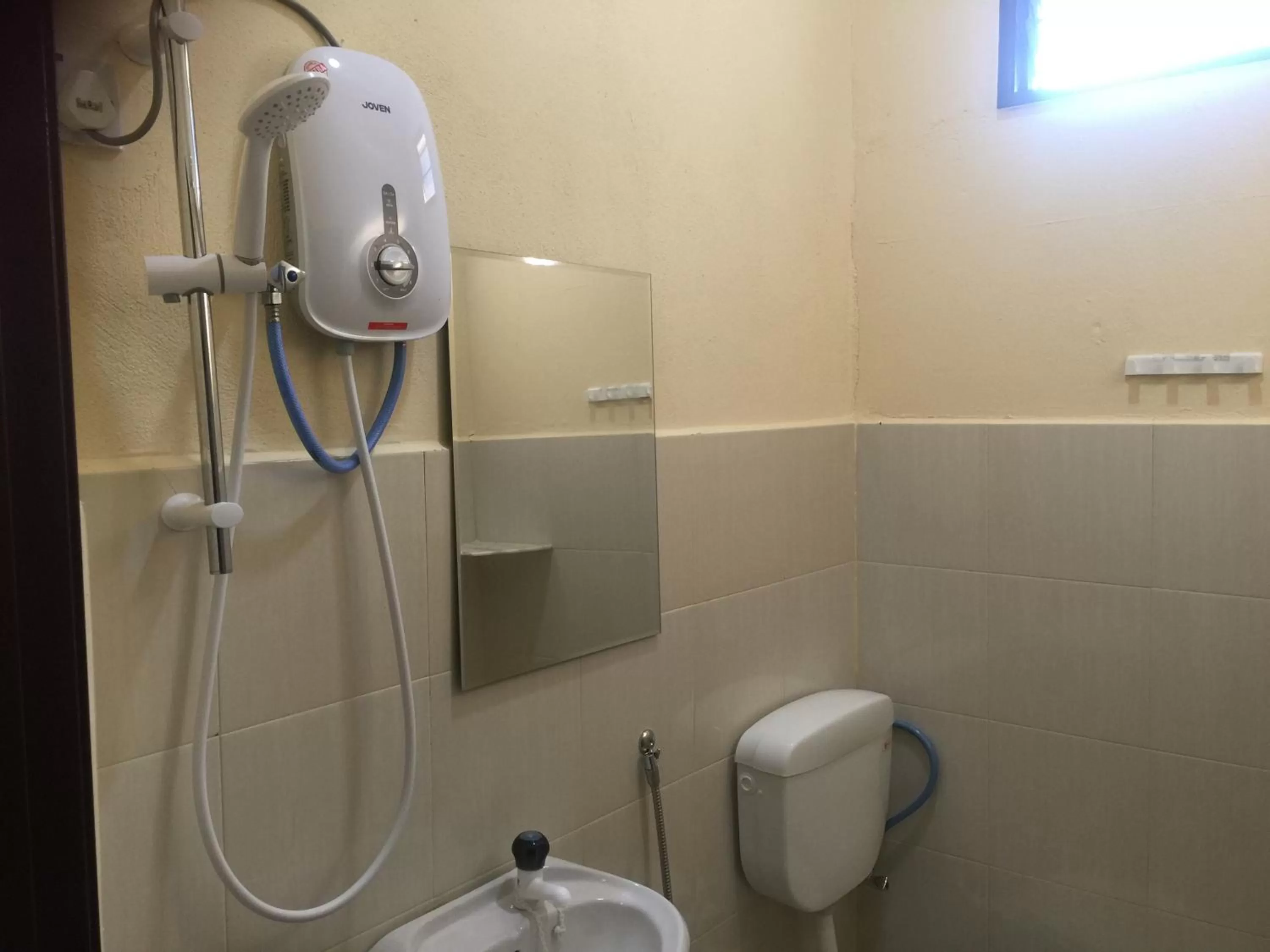 Shower in Dhania Cenang Beach Motel