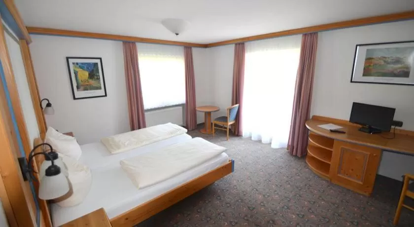 Photo of the whole room, Bed in Alpenhotel Widderstein