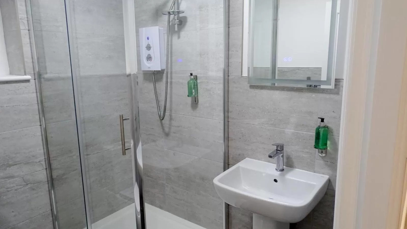 Shower in Cocoon @ International Inn + Apartments