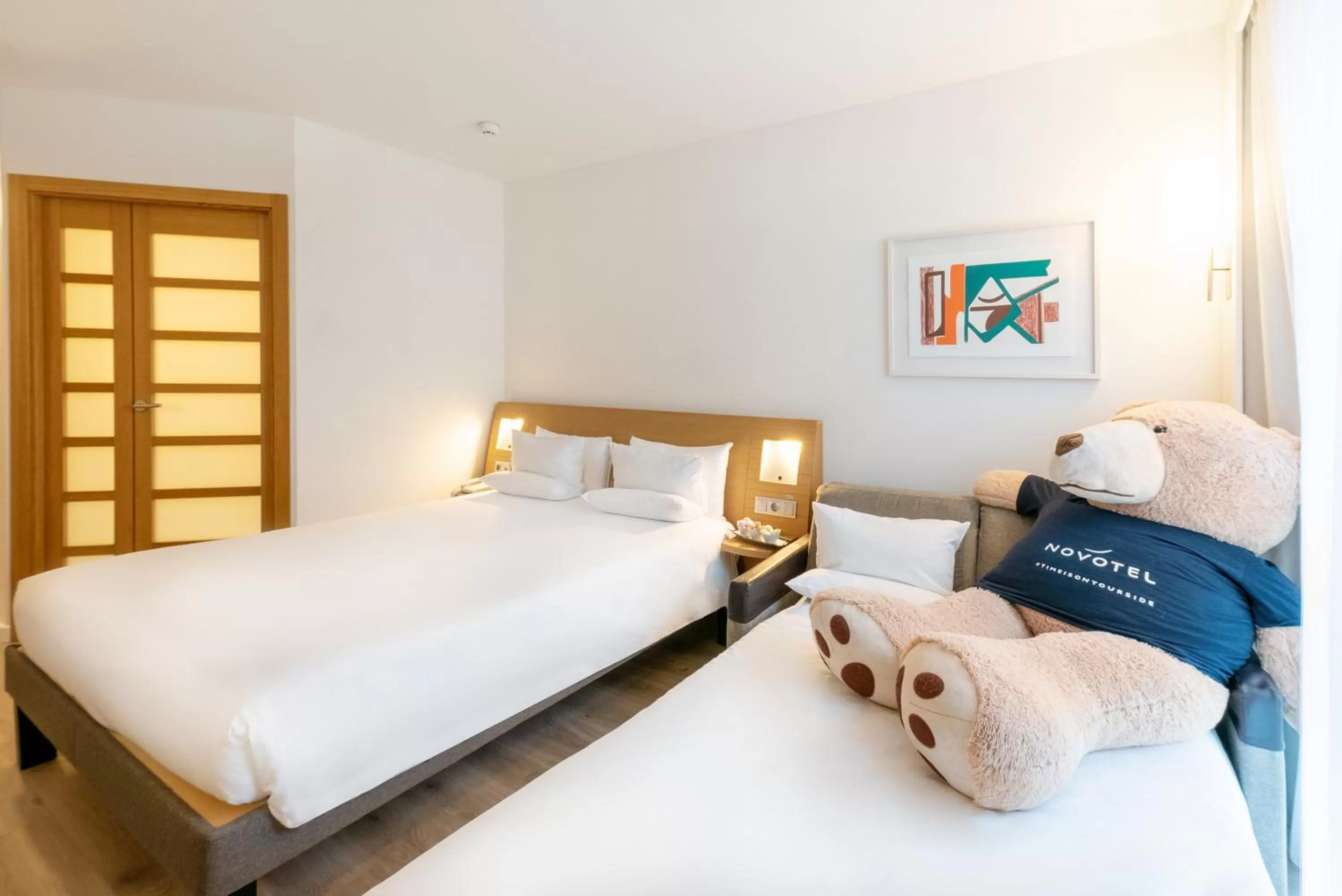 Bed in Novotel Barcelona City