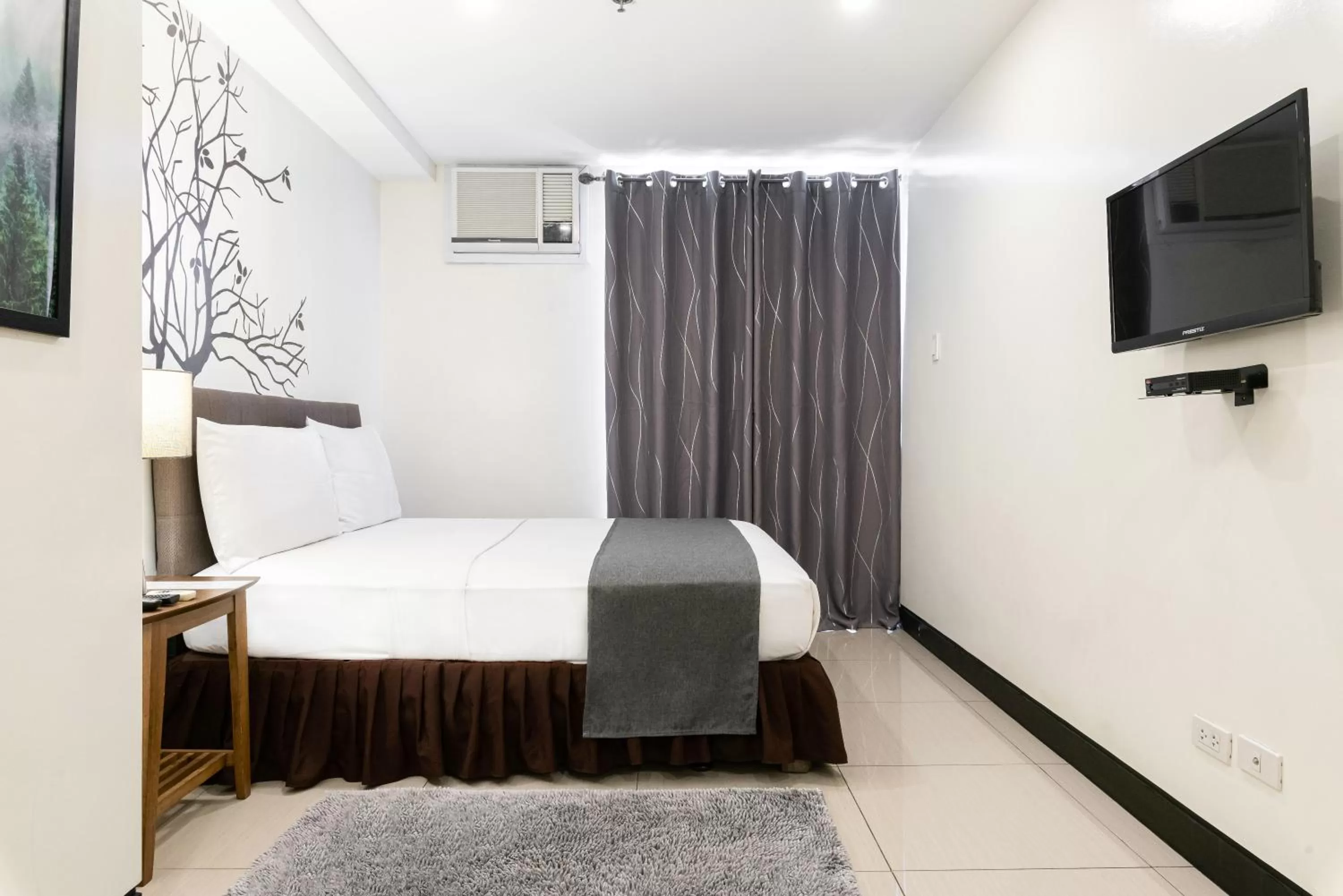 Bedroom, Bed in Artemis Place Makati Hotel