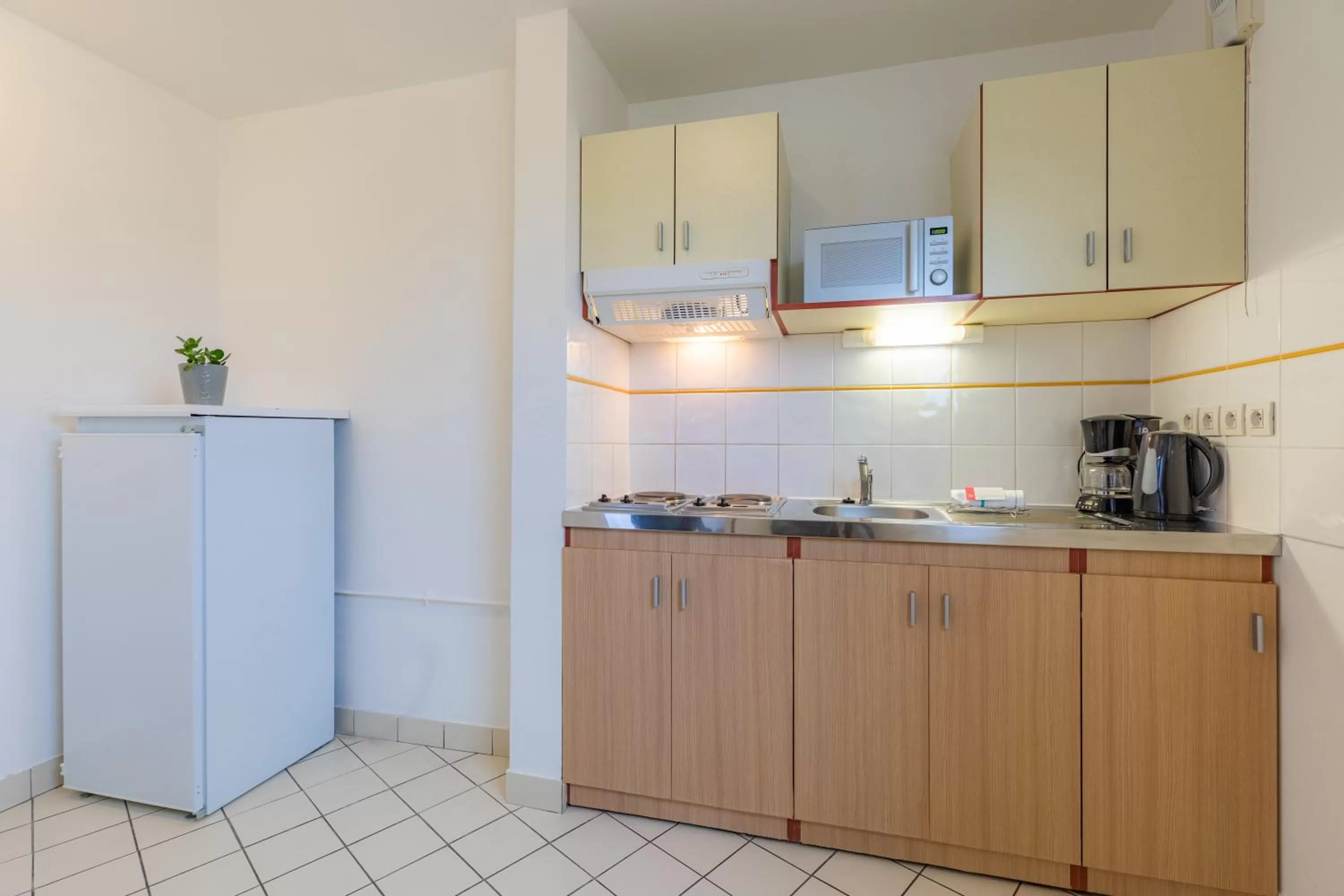 Kitchen or kitchenette in Appart'City Classic Caen