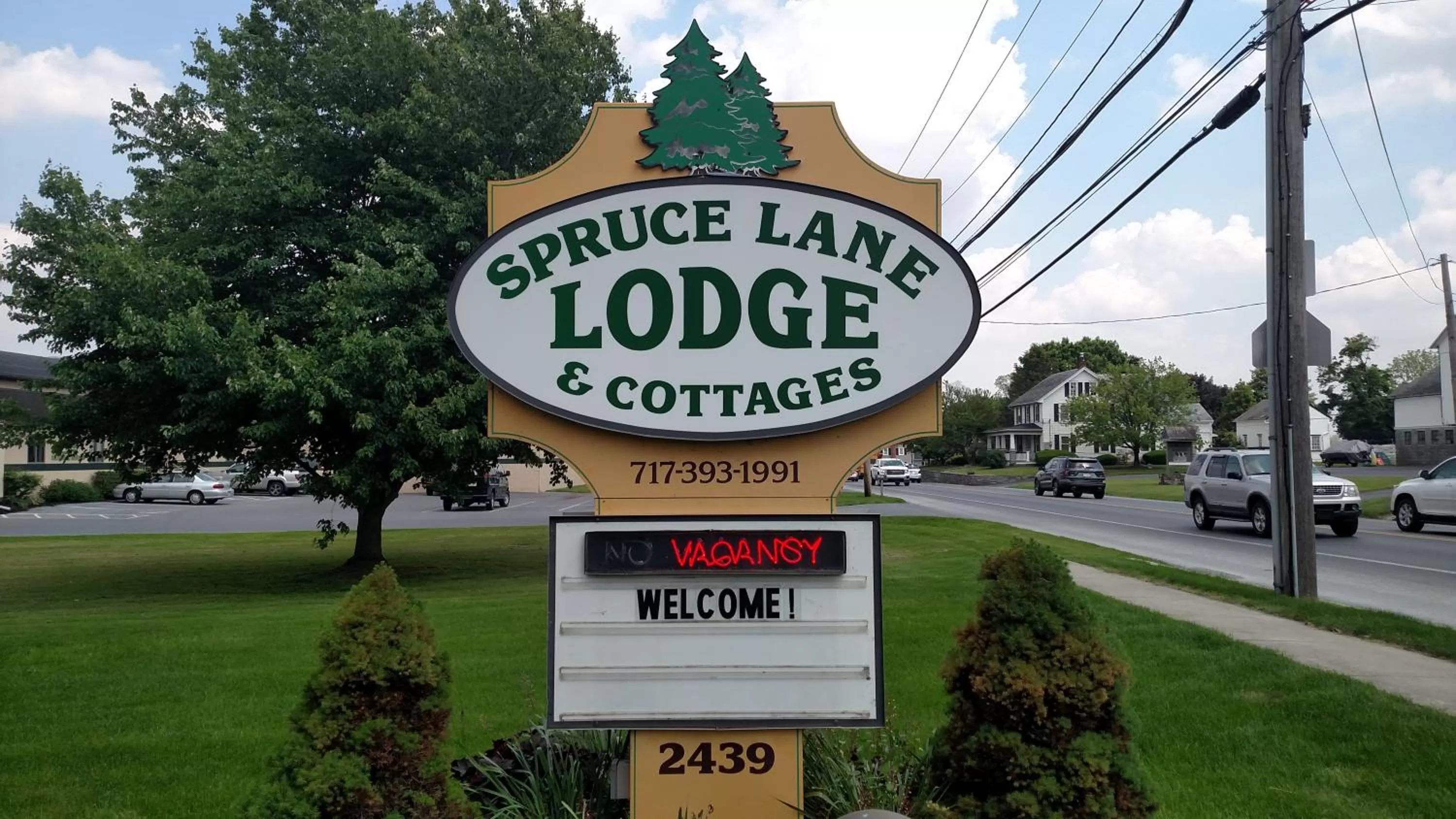 Property logo or sign in Spruce Lane Lodge and Cottages