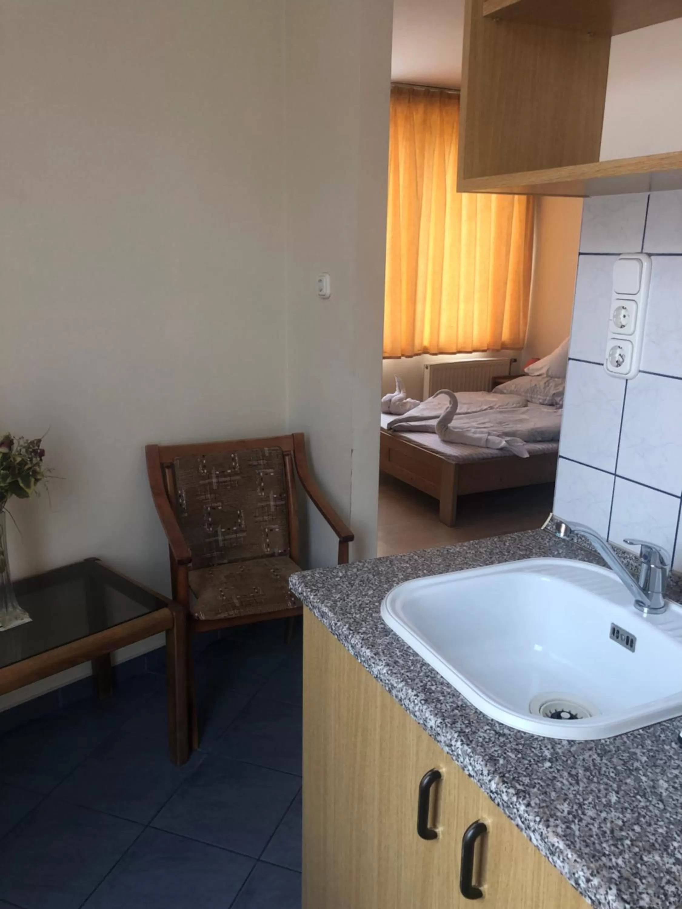 Kitchen or kitchenette in City Hotel Siófok