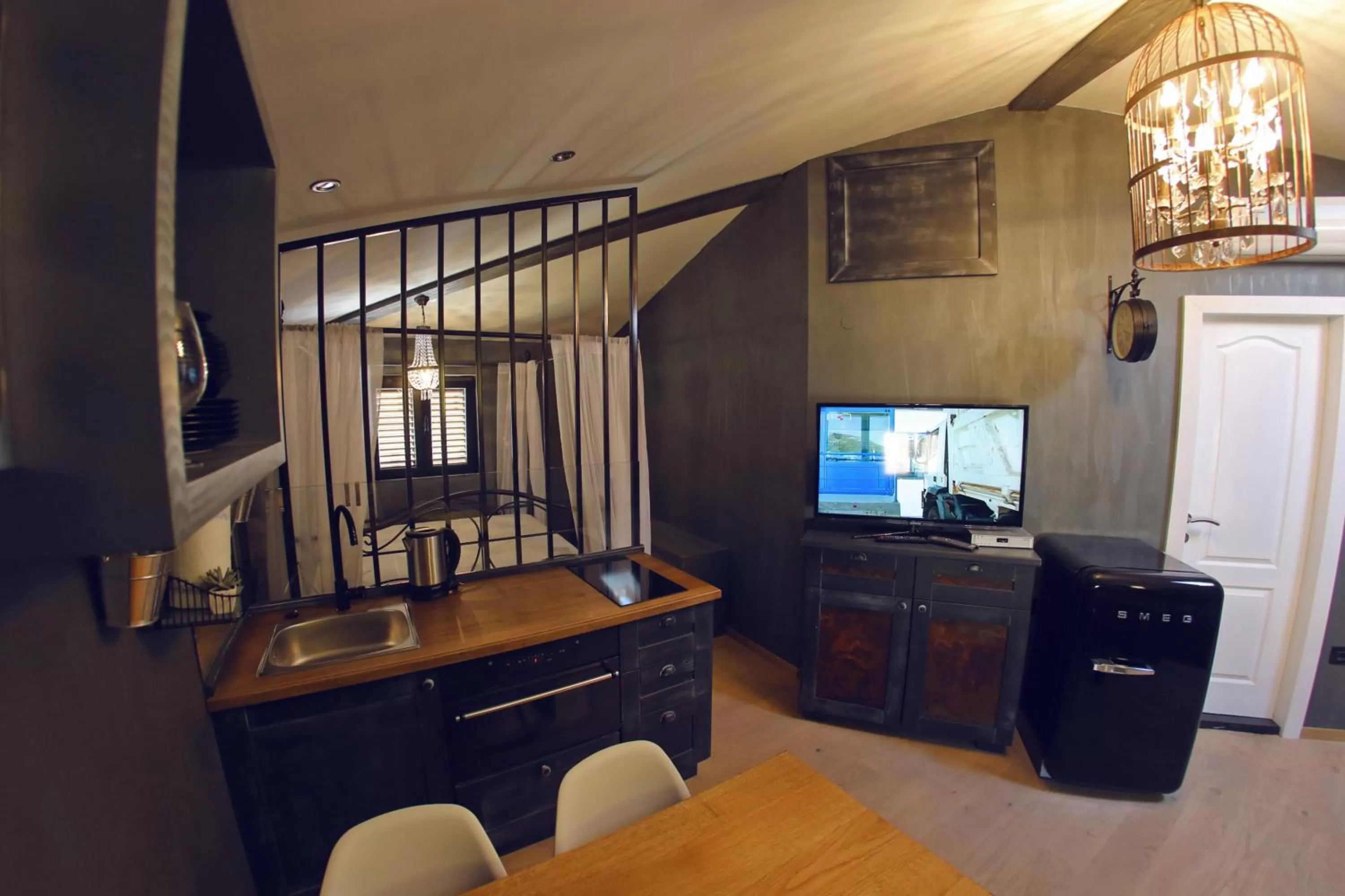 TV and multimedia in Central Apartments Integrated Hotel