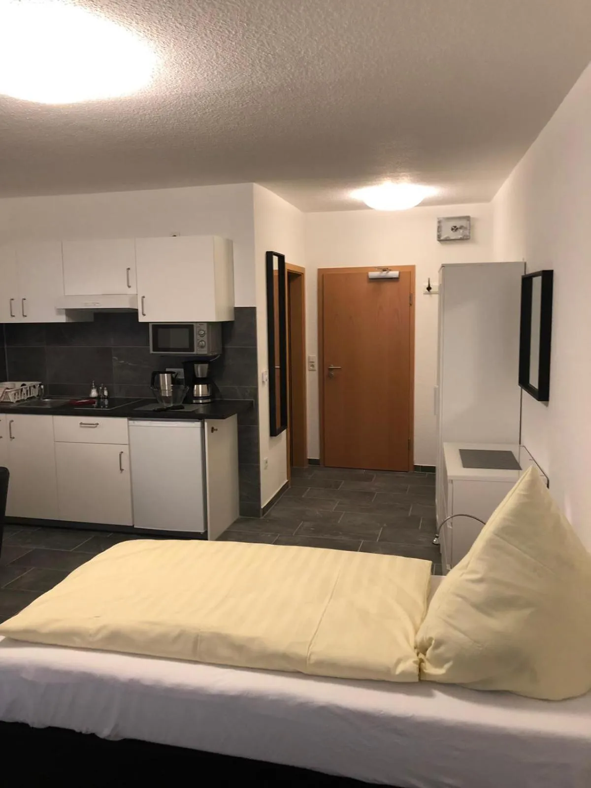 Kitchen or kitchenette, Bed in Hotel Am Kamin