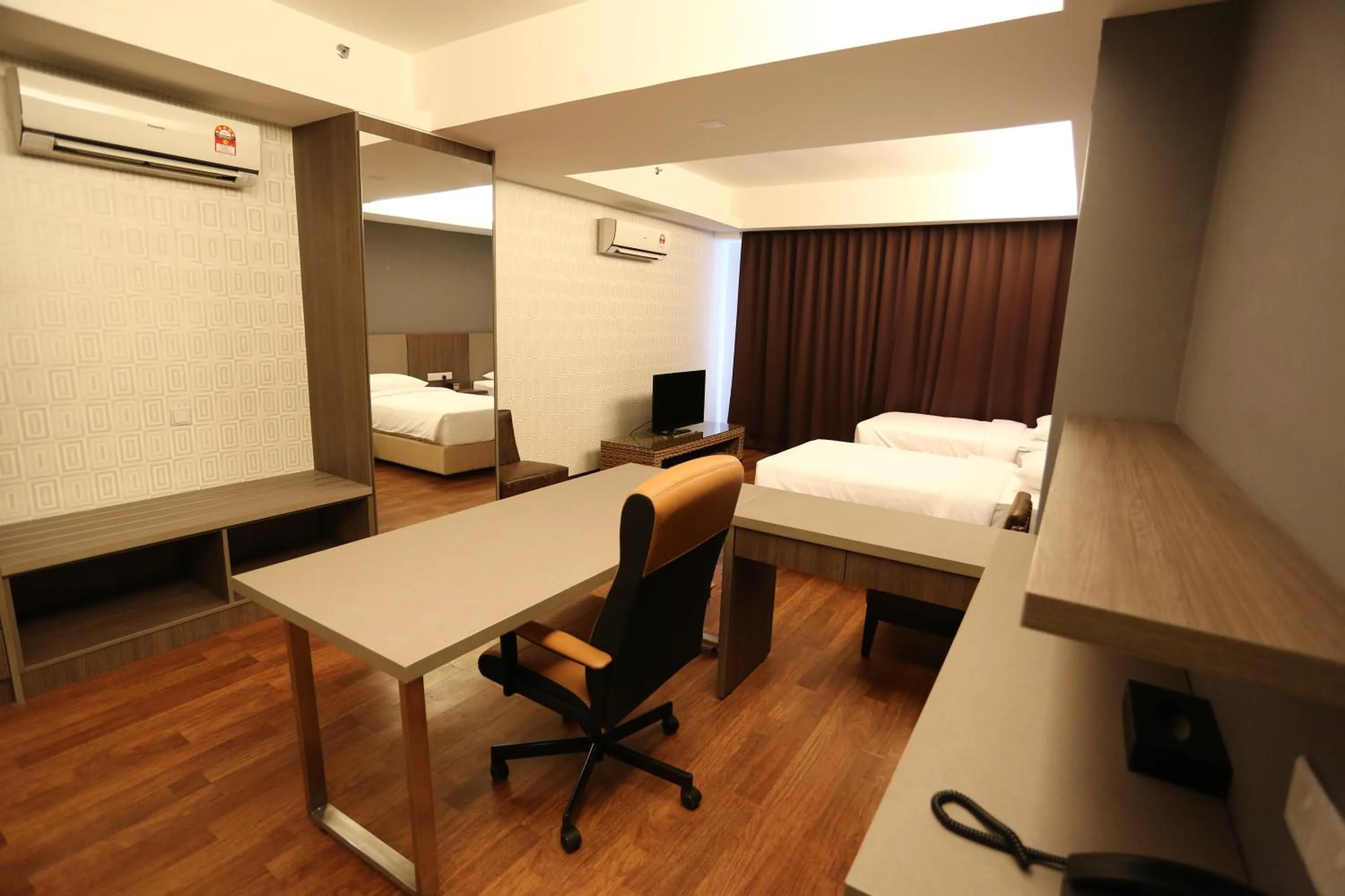 Seating area, Bed in Nexus Regency Suites & Hotel