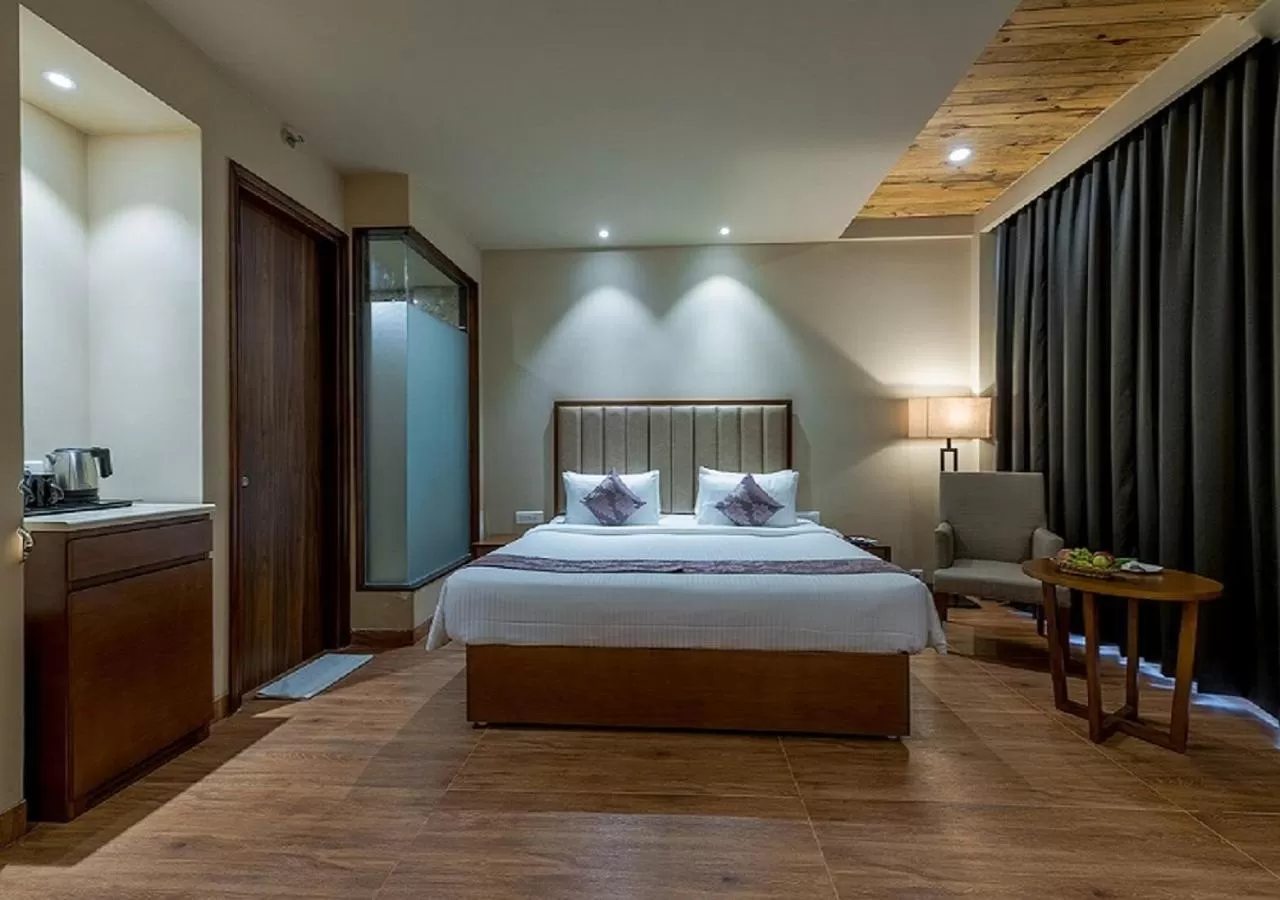 Bed in Hotel Cachar Club