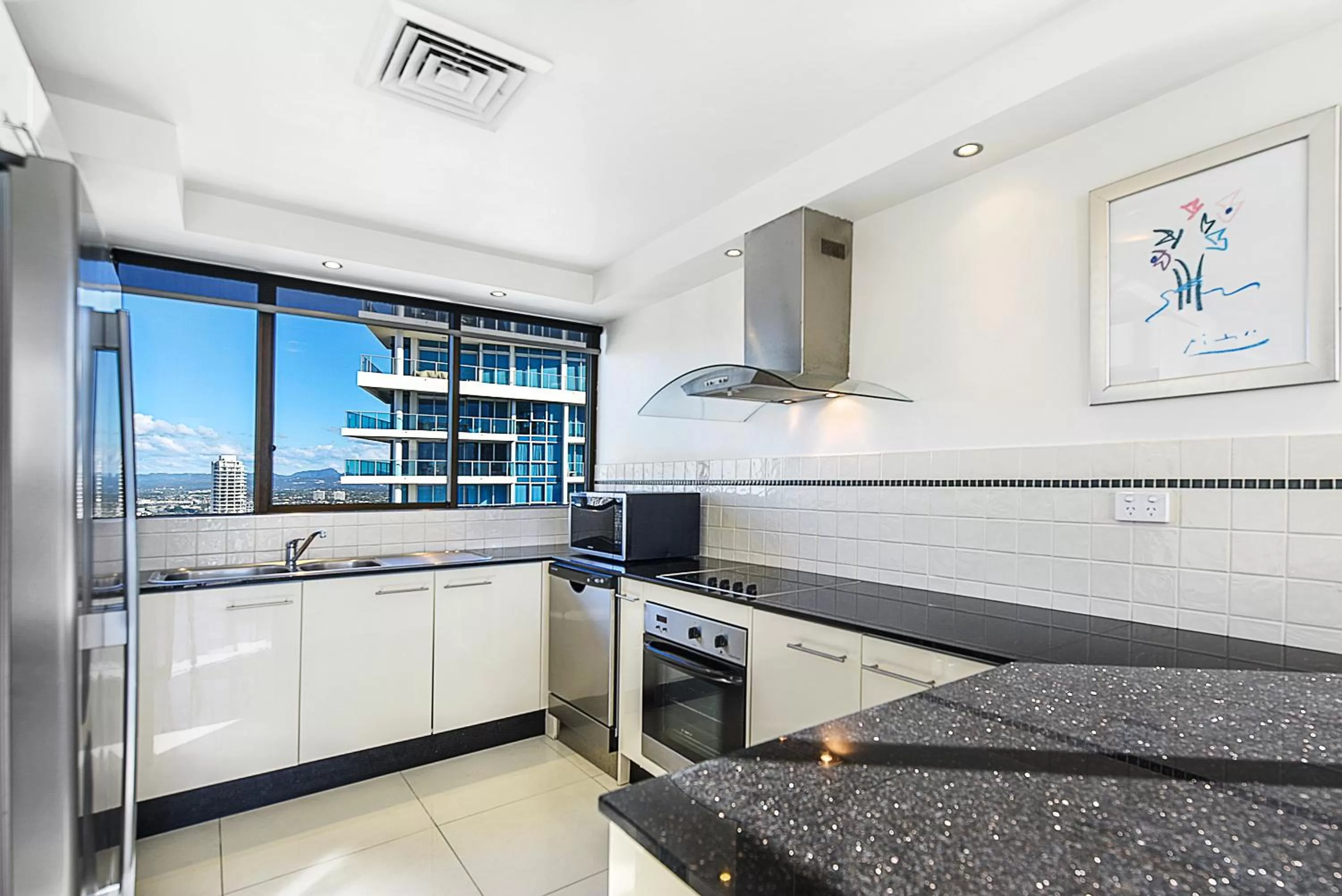 Kitchen or kitchenette in Surfers Century Oceanside Apartments