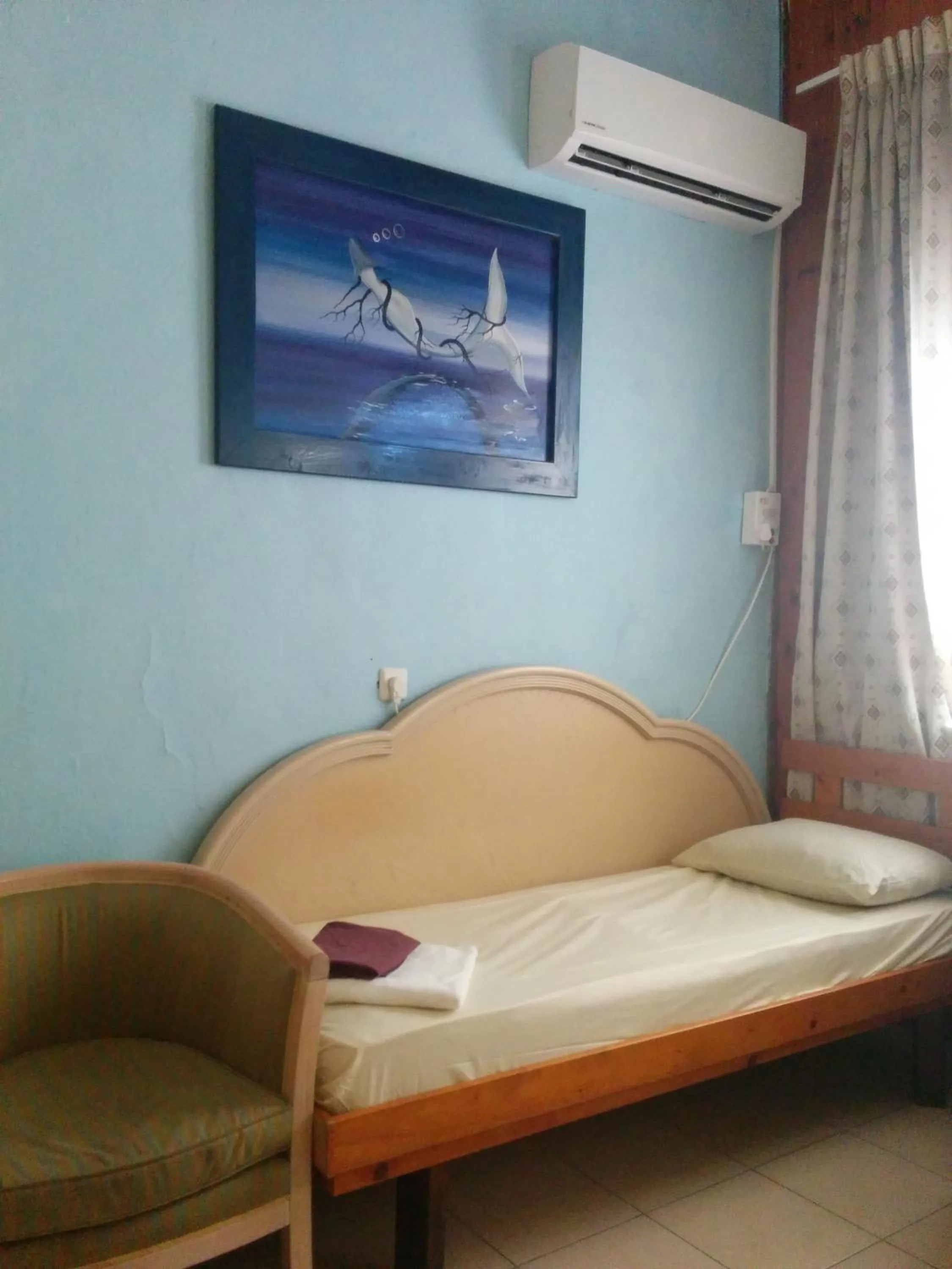 Seating area, Bed in Momo's Hostel