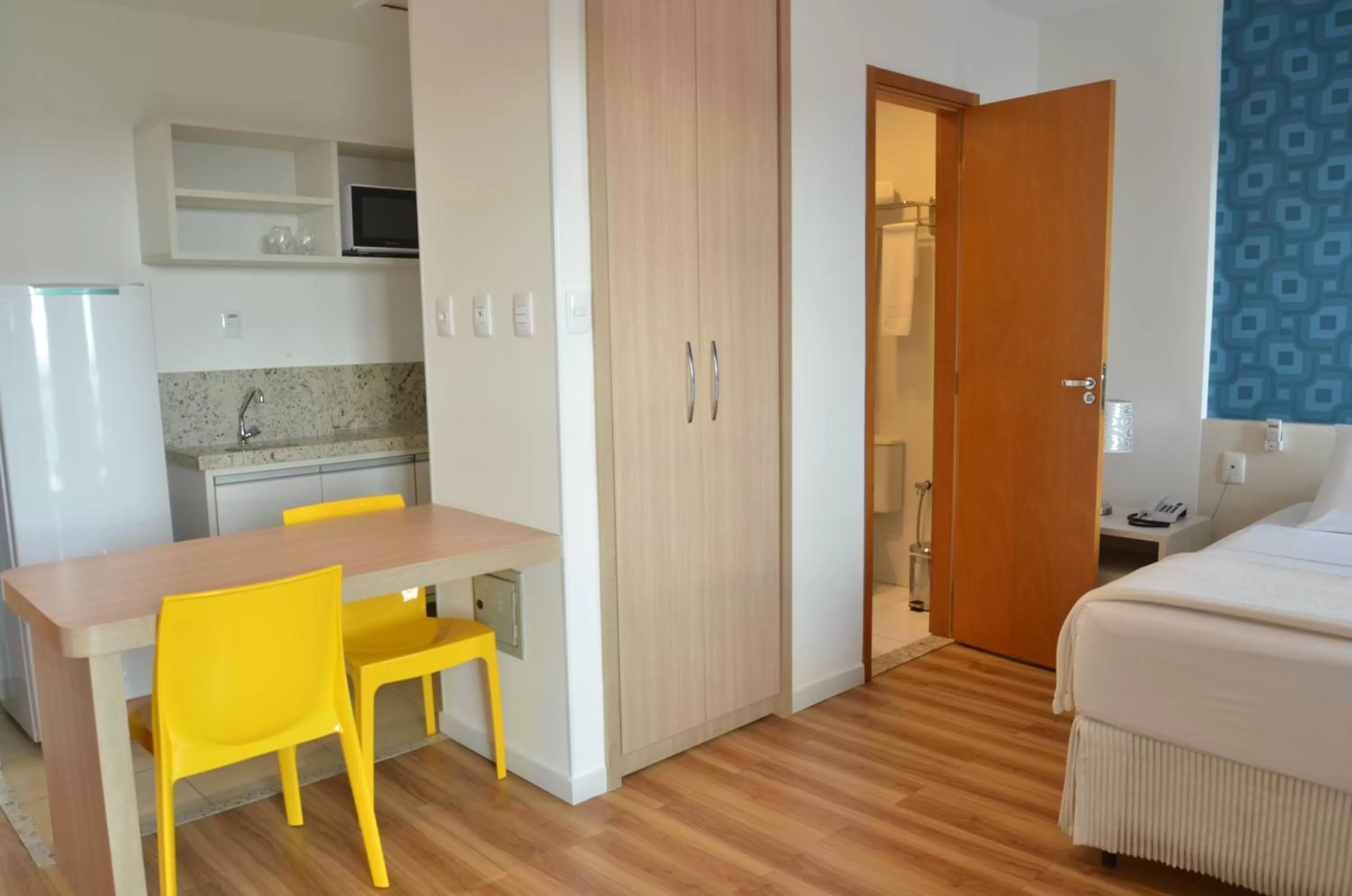 Kitchen or kitchenette, Bed in Unico Apart Hotel