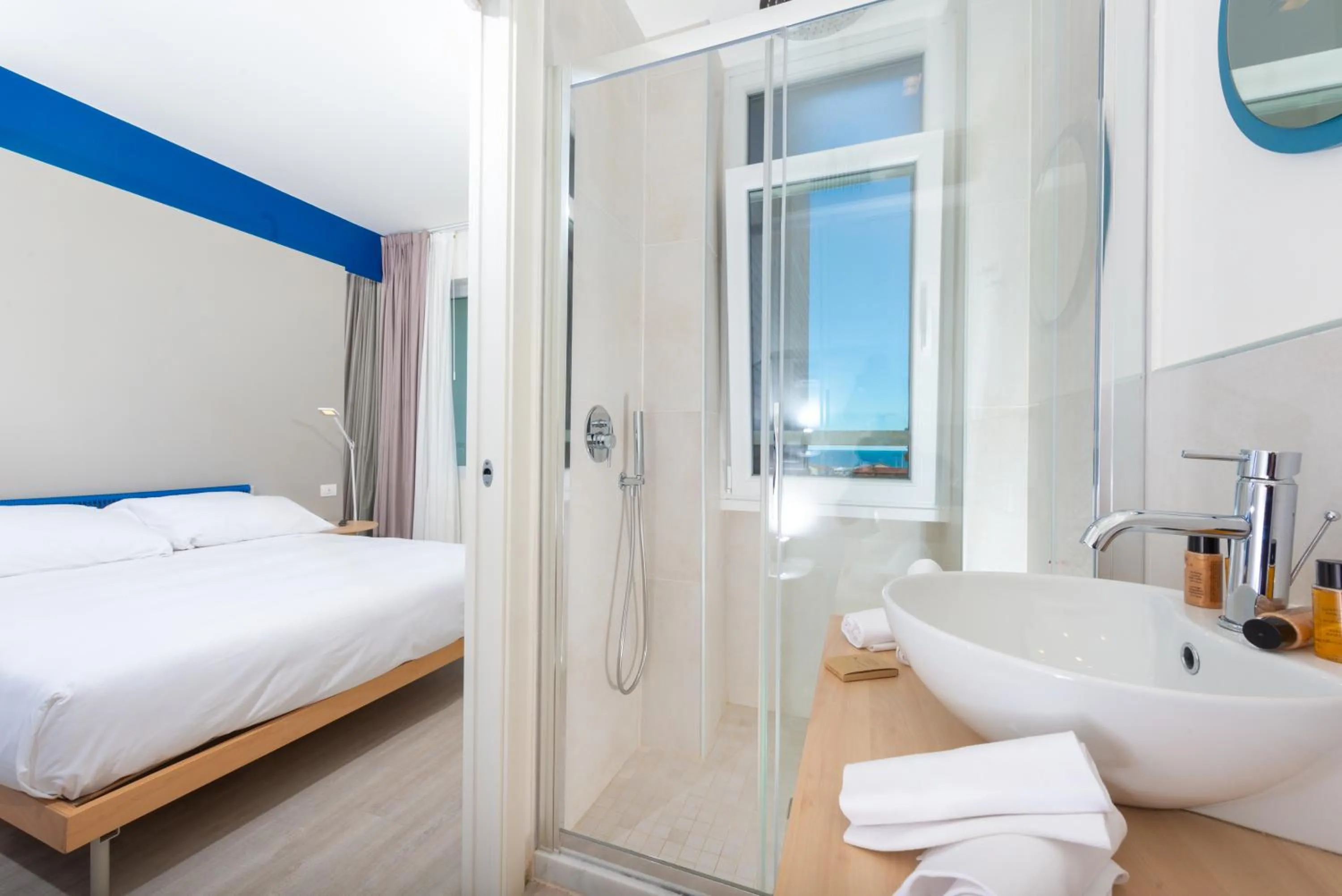 Shower, Bed in Amarina Hotel