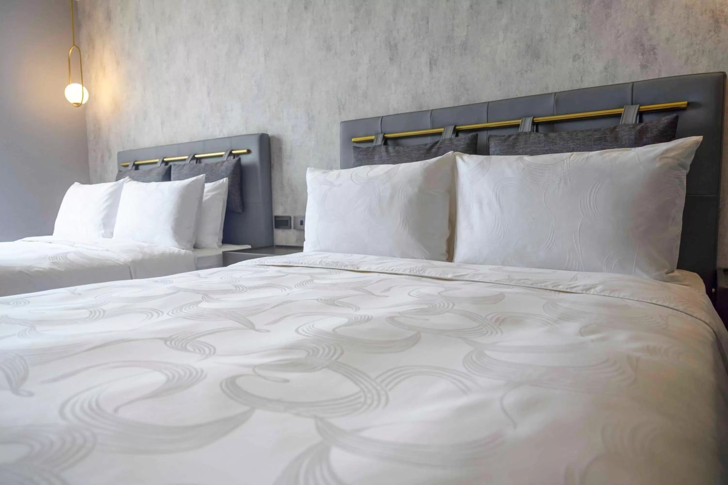 Bed in Tenz Go Hotel