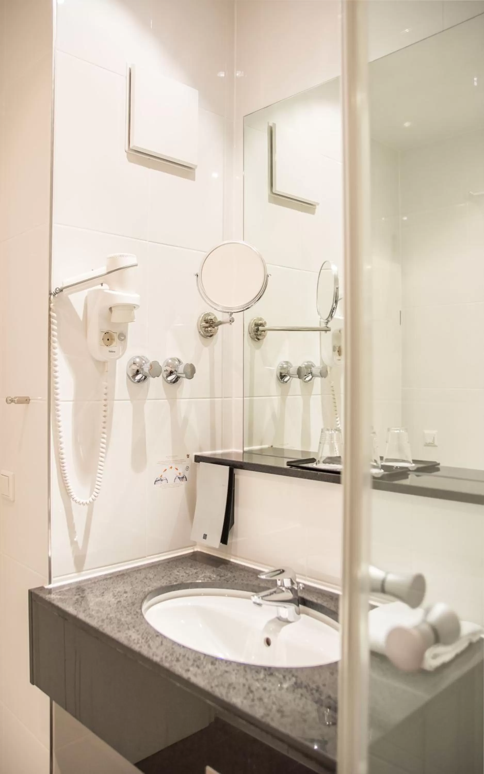 Bathroom in Ramada by Wyndham München Airport