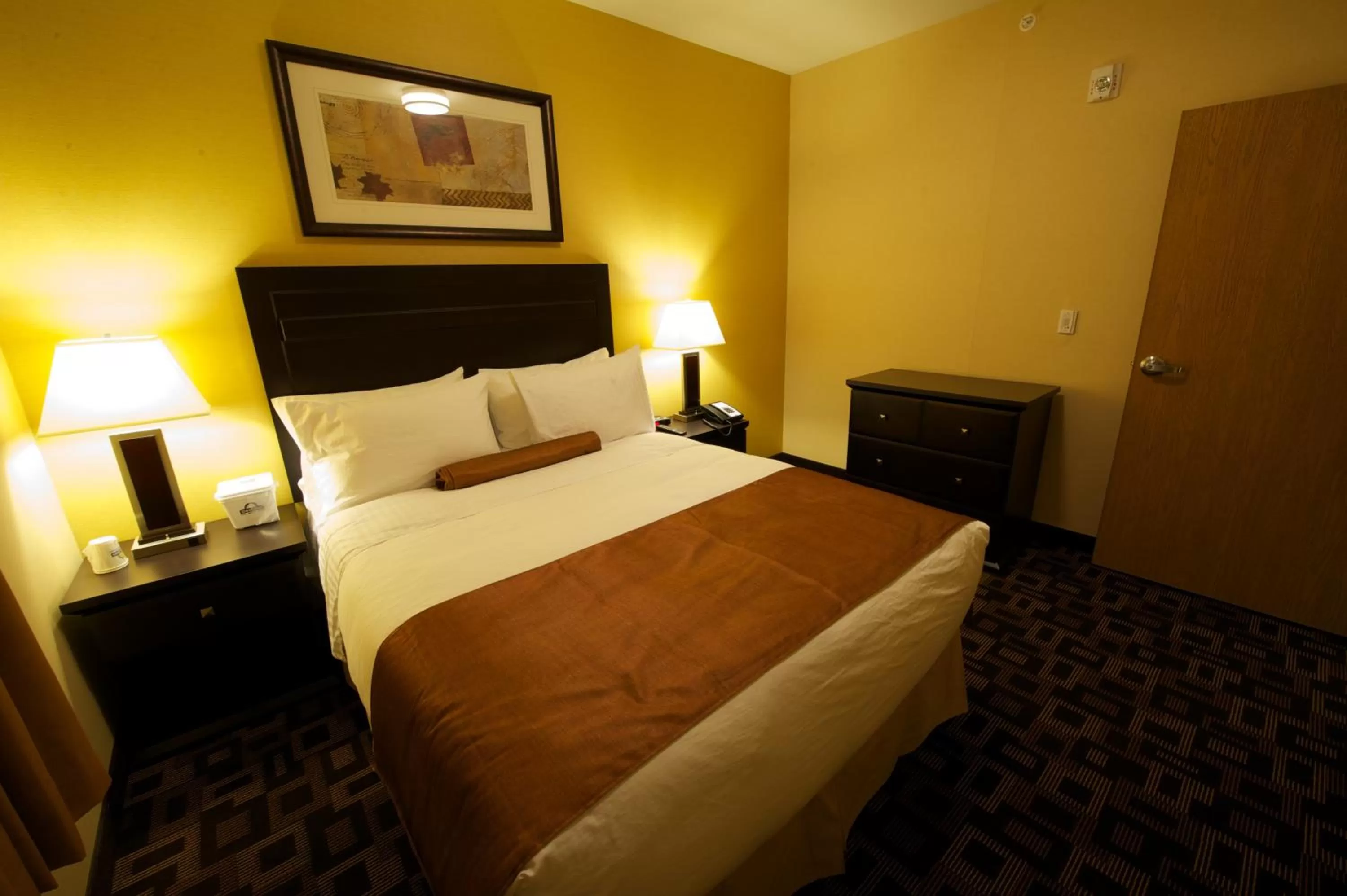 Bed in Days Inn & Suites by Wyndham Winnipeg Airport Manitoba