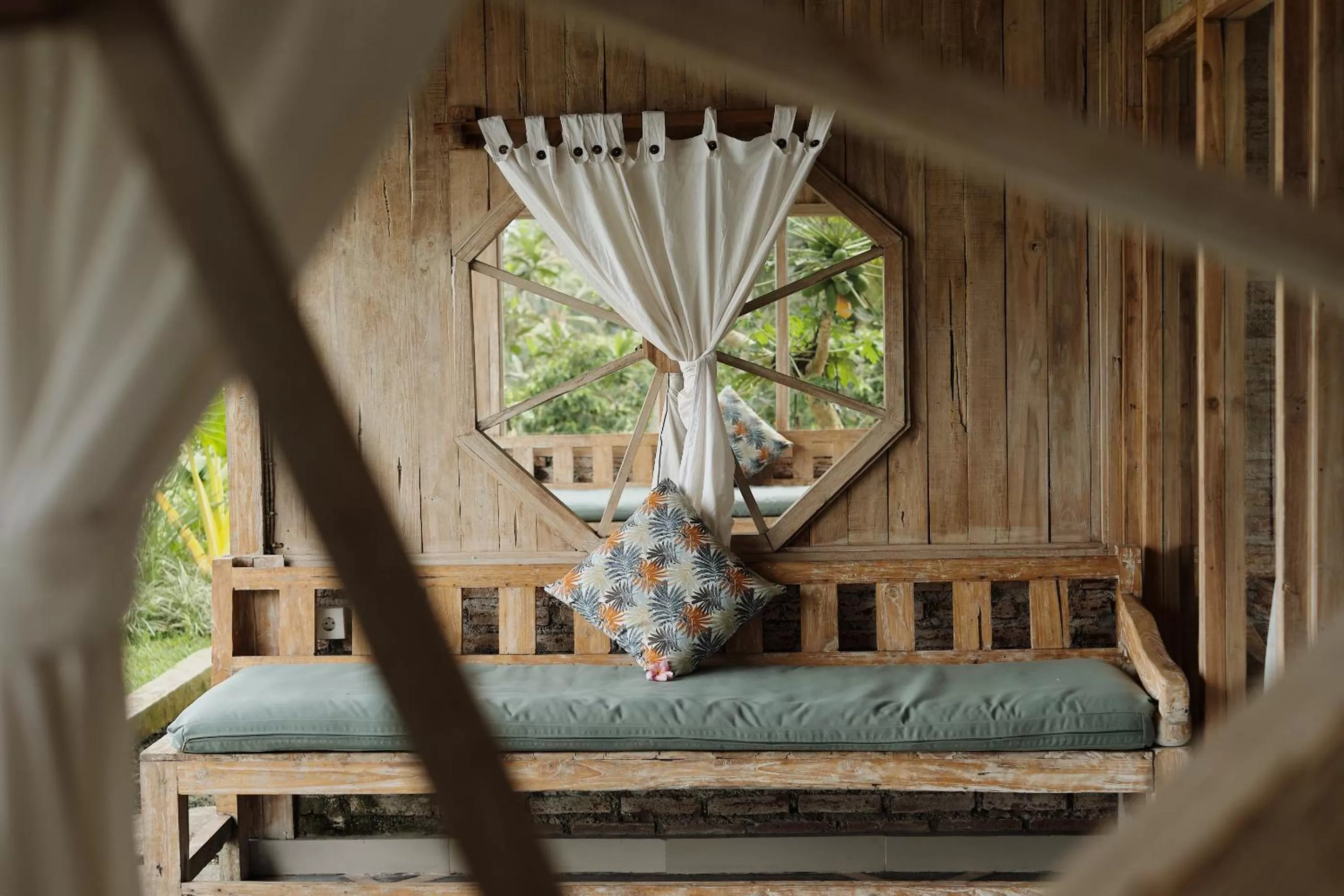 Seating area in Joglo Organik Guesthouse