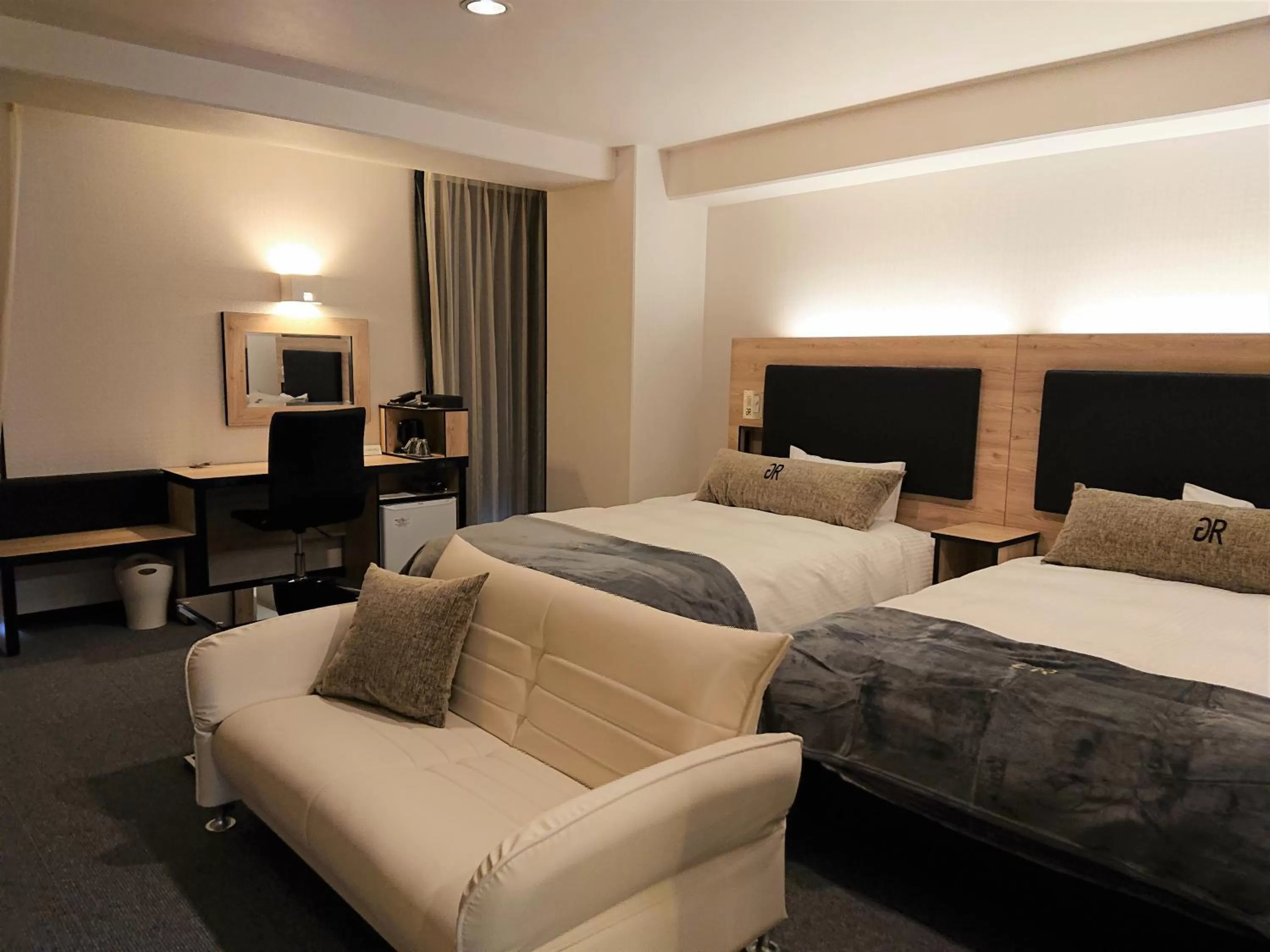 Bed in Green Rich Hotel Kurume Natural Hot Spring Arimamutsumonnoyu