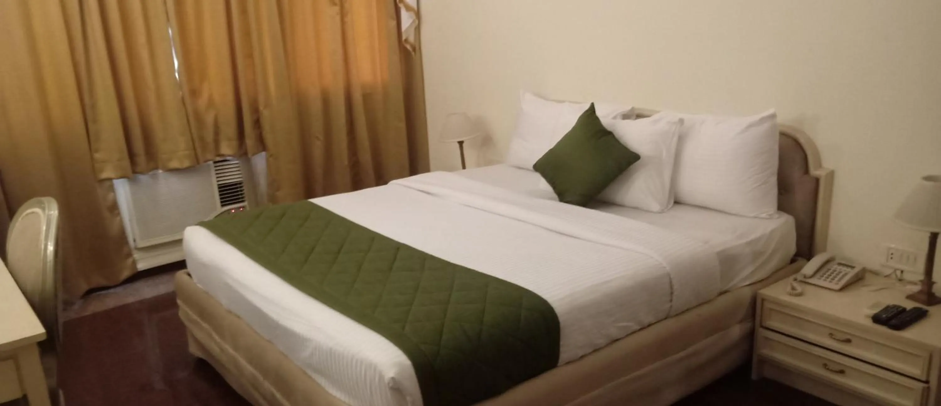Bed in Hotel Poonja International
