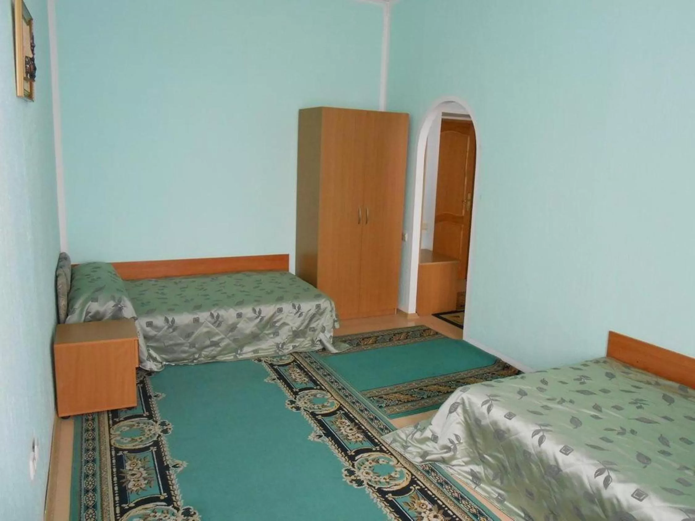 Bed in Zhibek Zholy Hotel