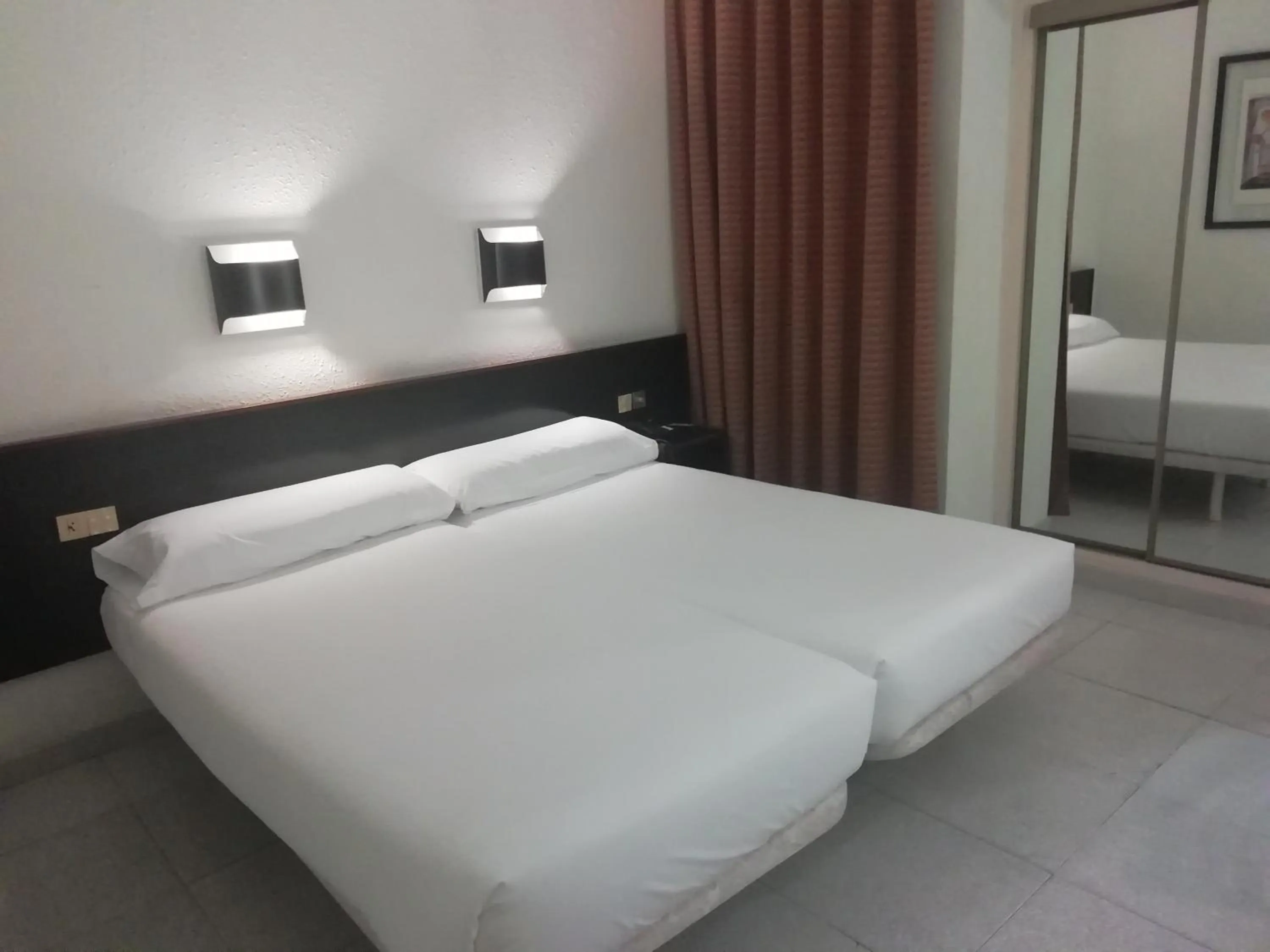 Bed in Hotel Monegal