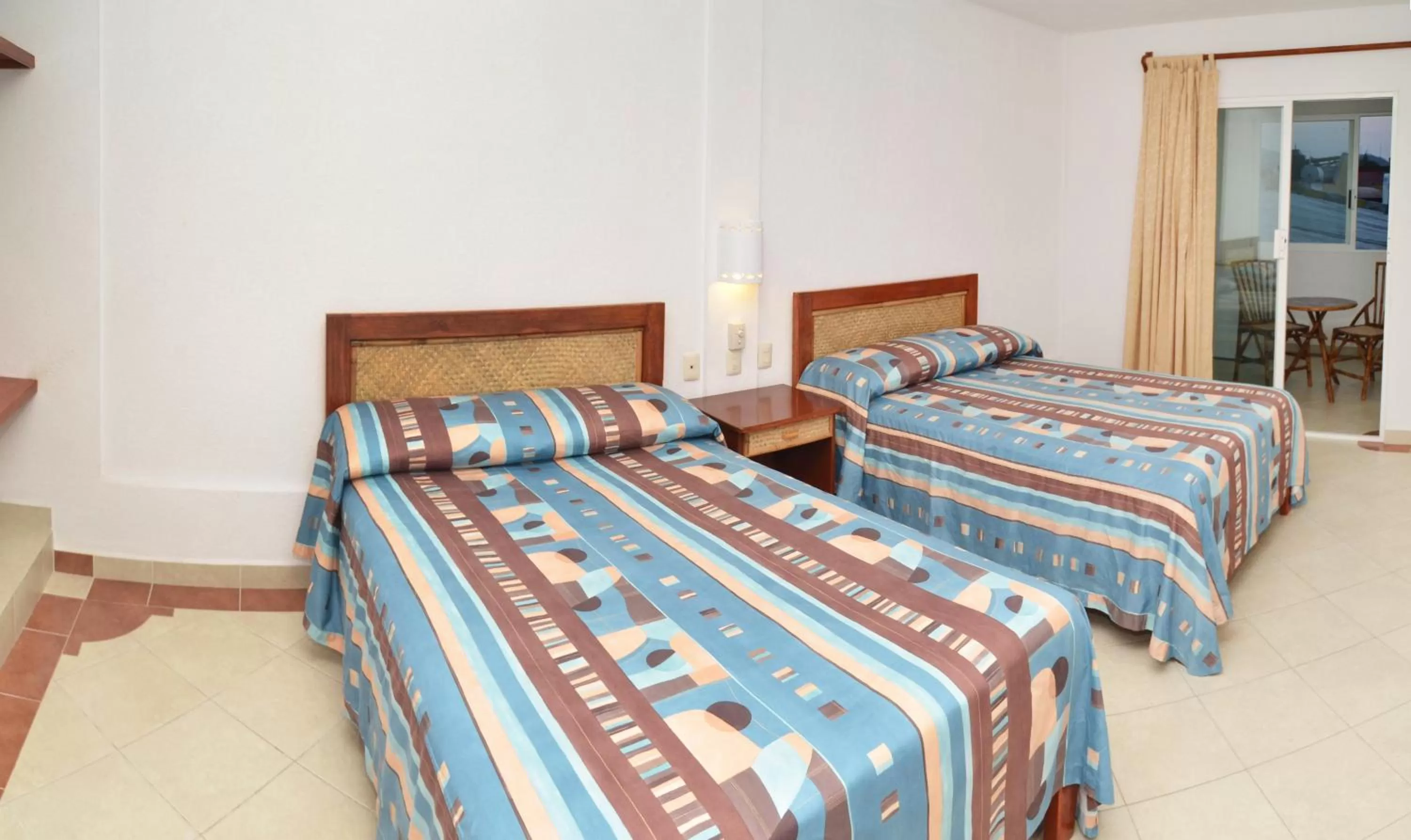 Photo of the whole room, Bed in Hotel Suites Ixtapa Plaza