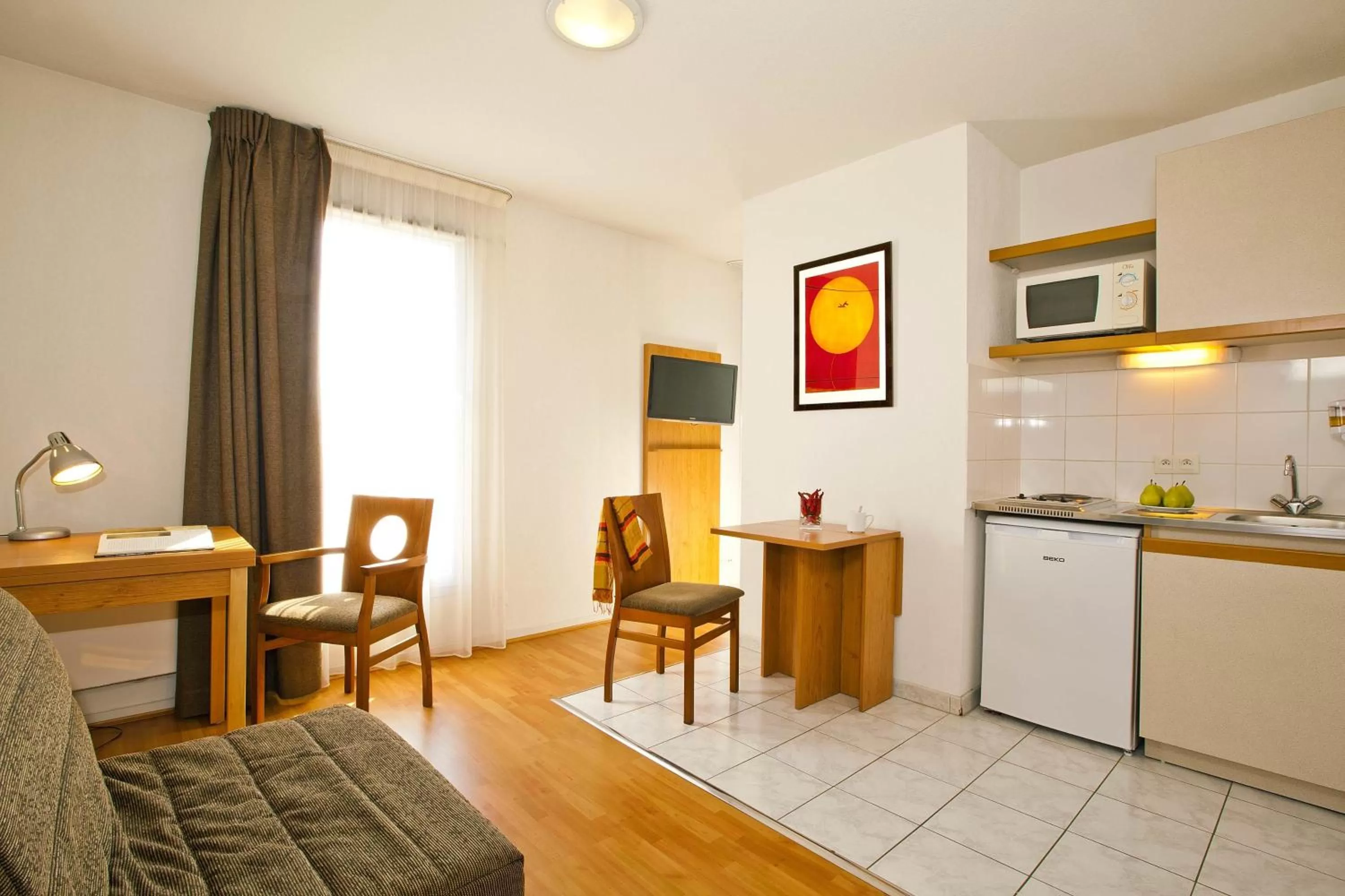 Kitchen or kitchenette in Séjours & Affaires Nantes La Beaujoire