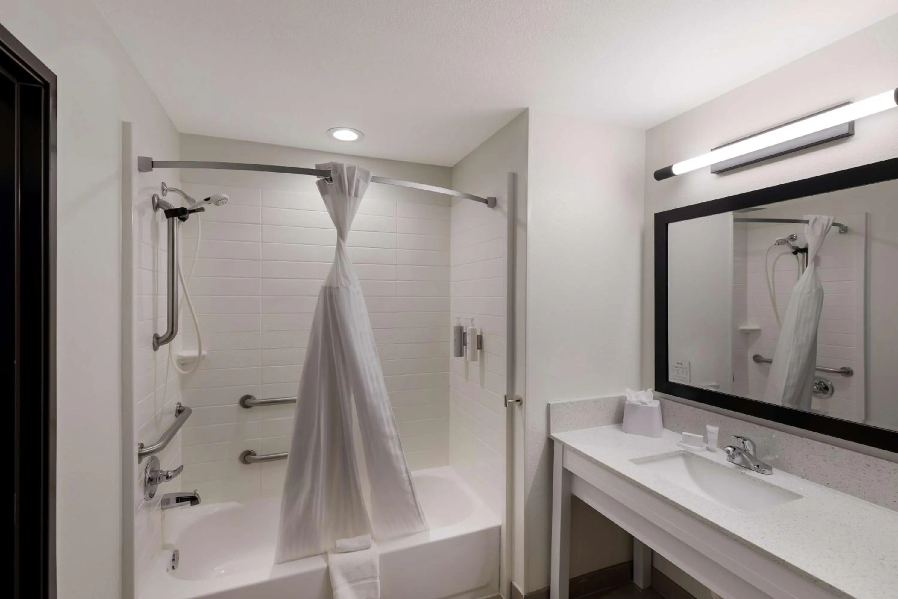 Bathroom in Spark by Hilton Midland South