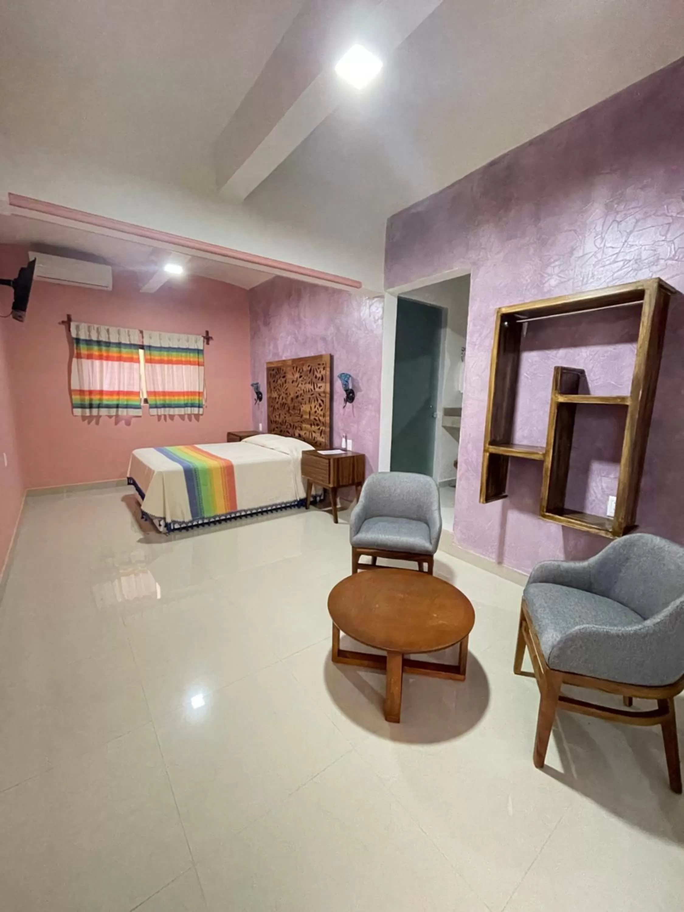 Seating area, Bed in Suites Cárdon