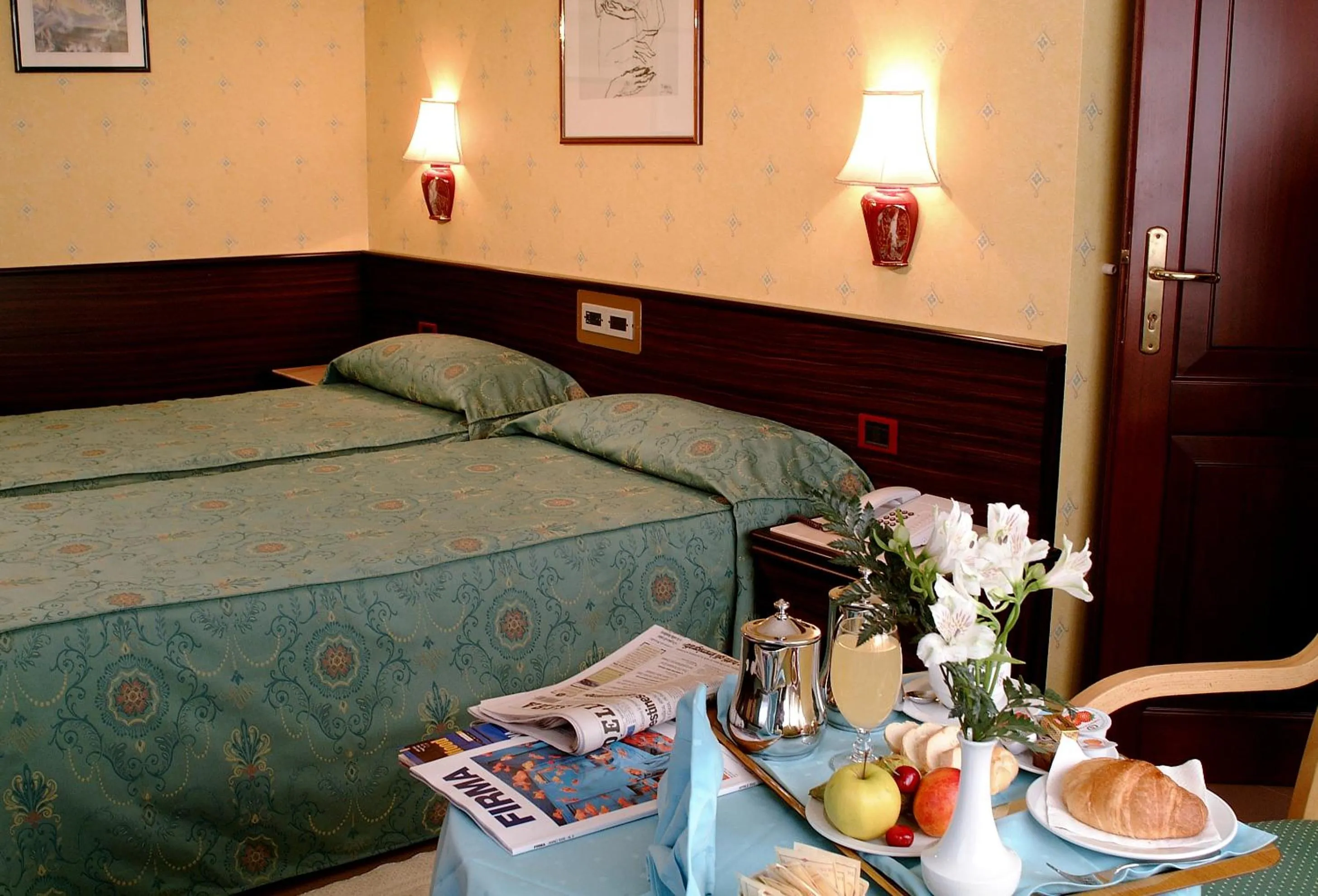 Bed in Hotel Leonardo Da Vinci
