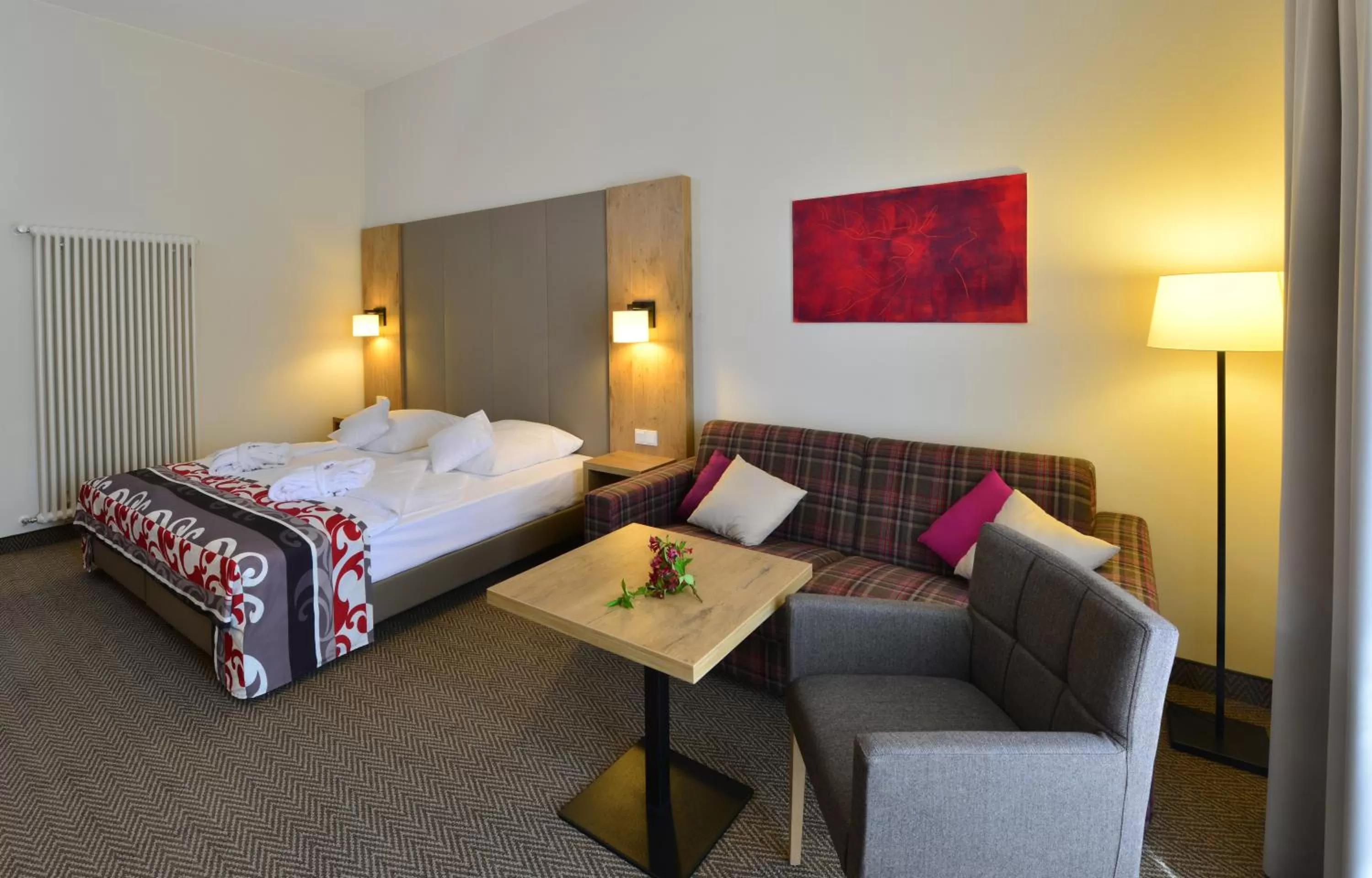 Living room, Bed in Santé Royale Hotel- & Gesundheitsresort Warmbad Wolkenstein