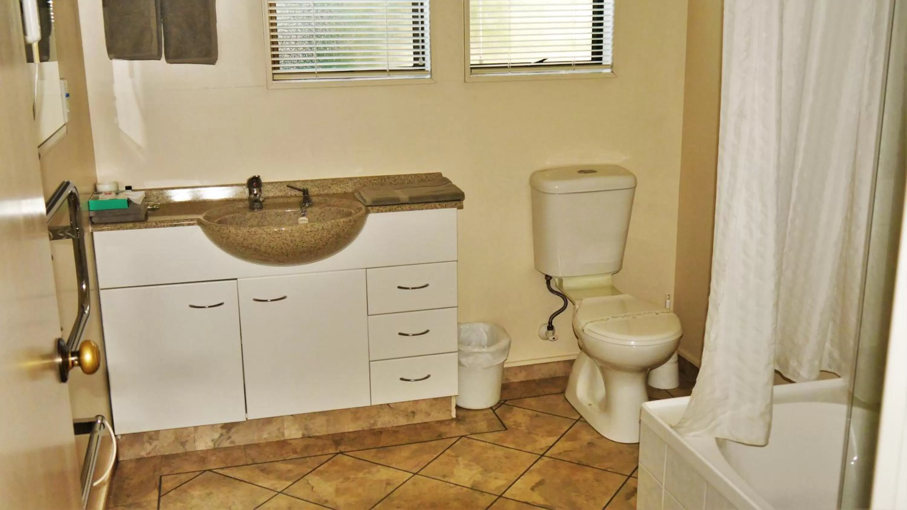 Shower in Tudor Lodge Motel