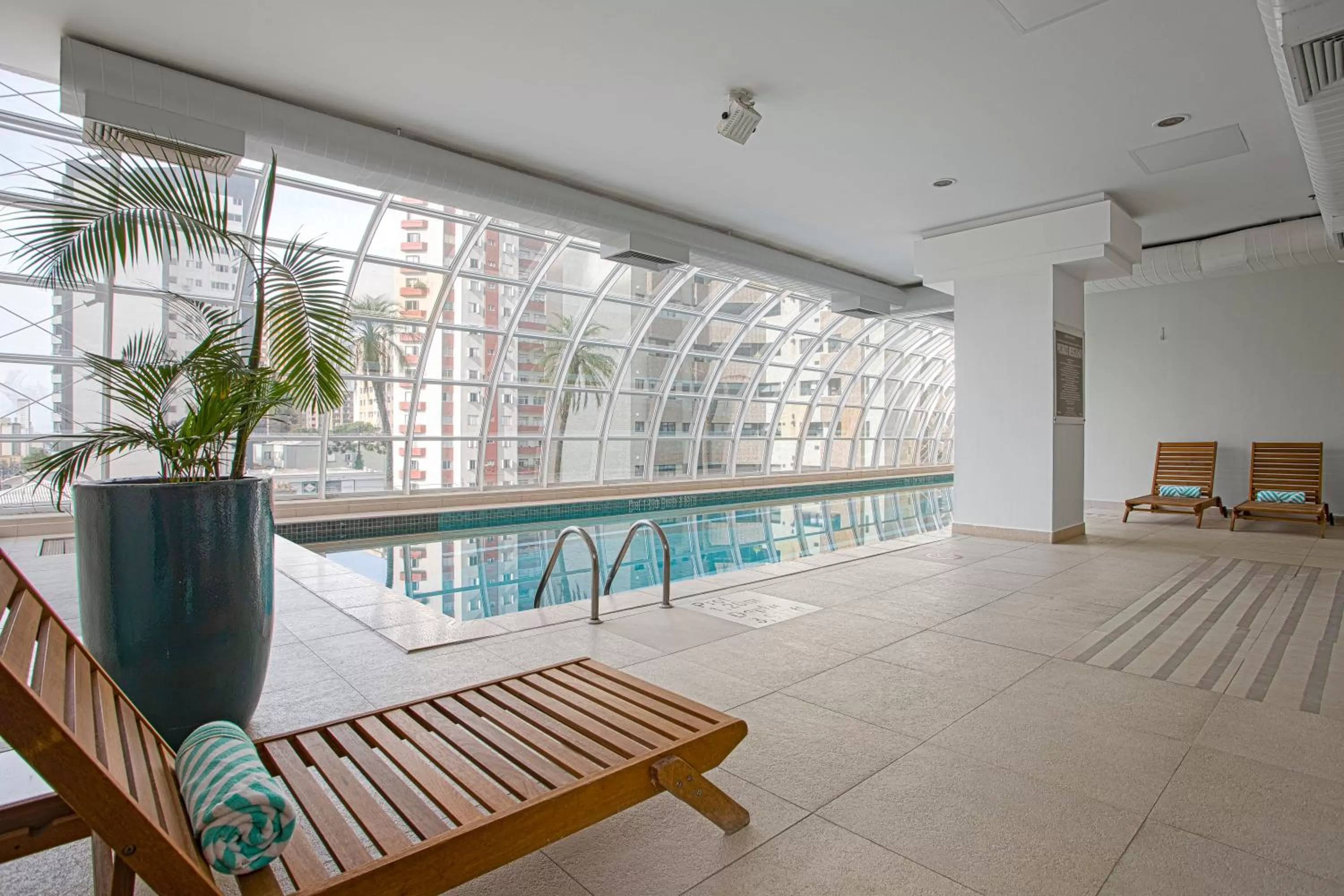 Pool view in QOYA Hotel Curitiba, Curio Collection by Hilton