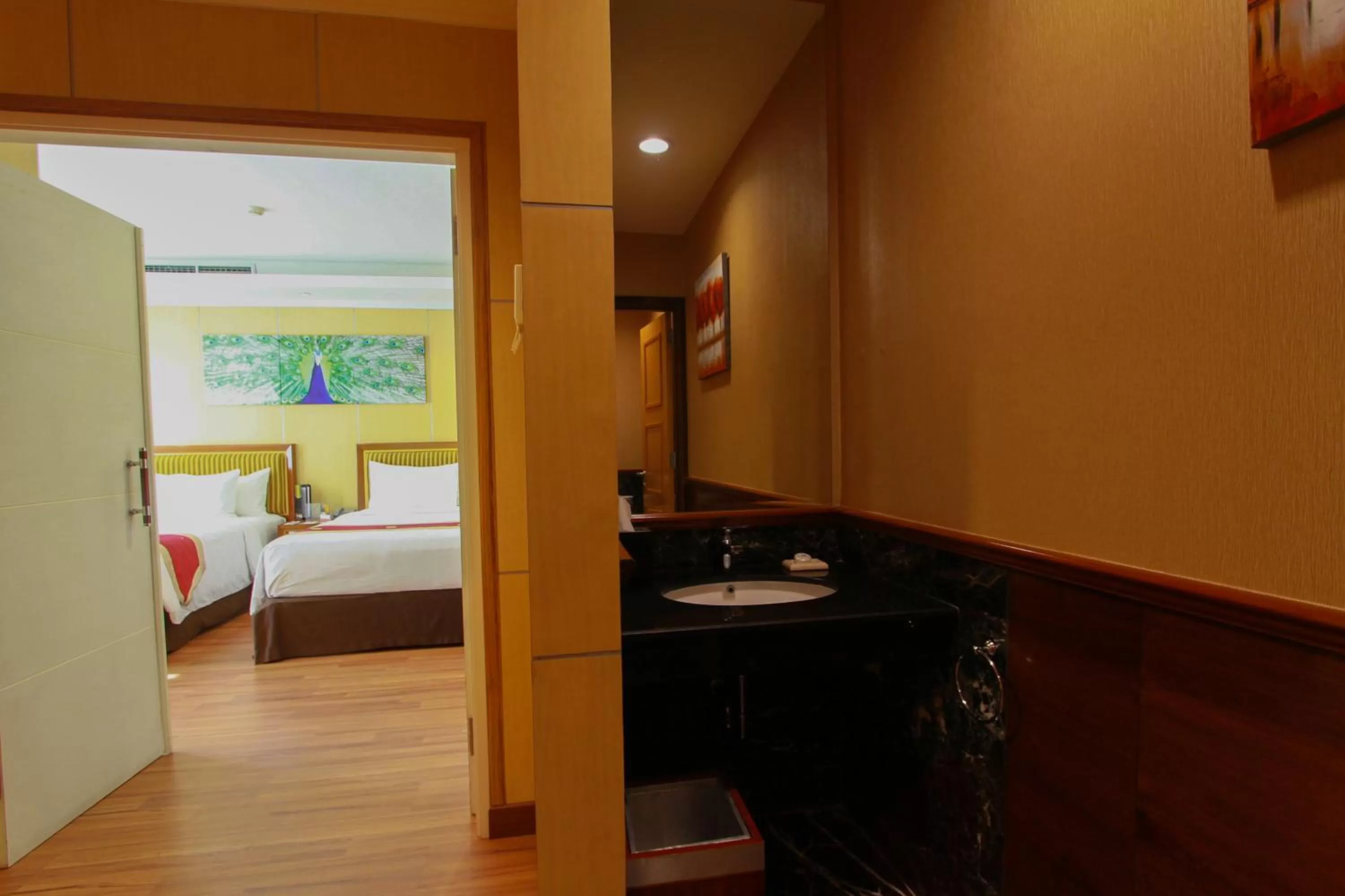 Photo of the whole room, Bed in Swiss-Belhotel Maleosan Manado