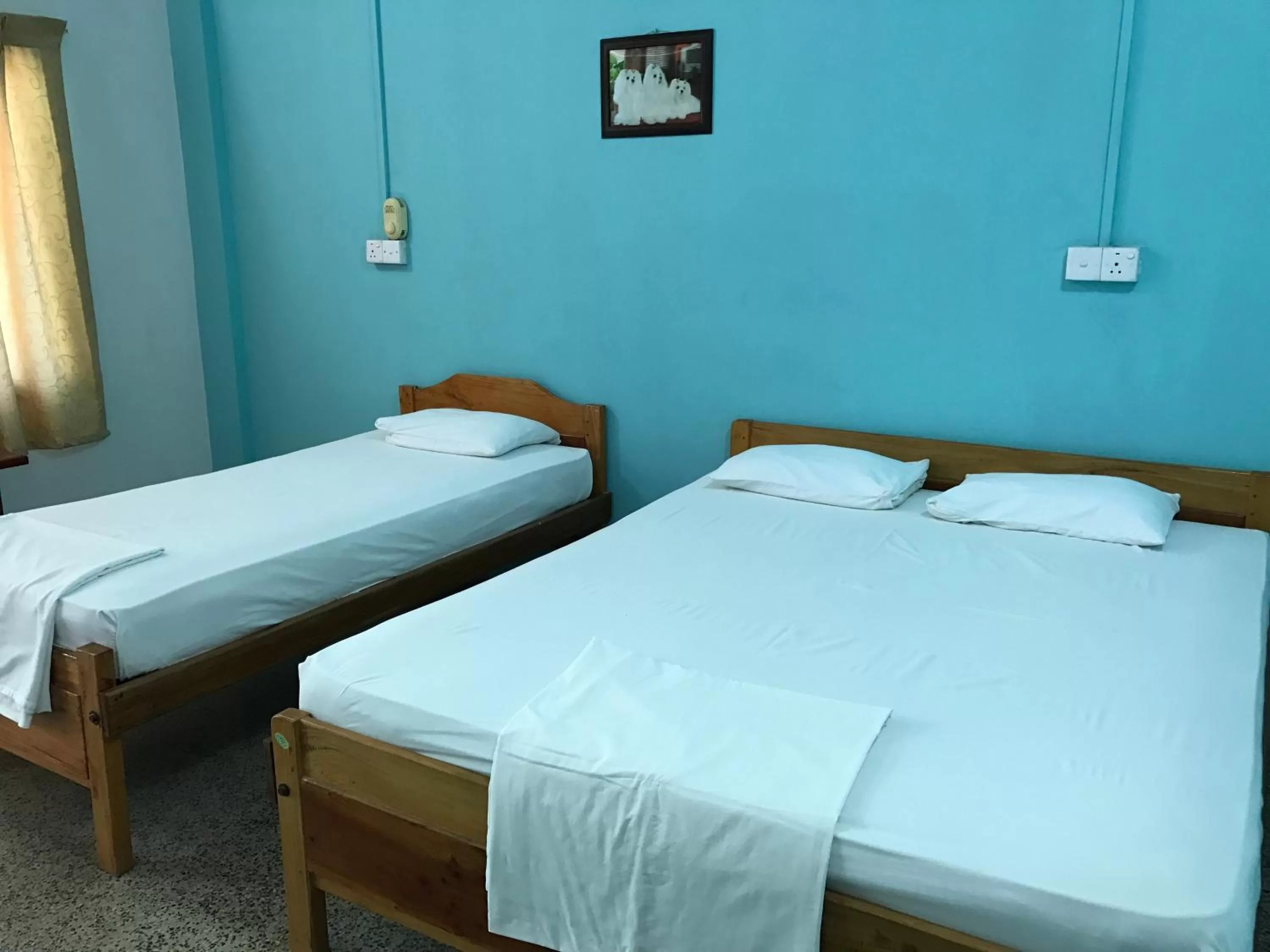 Bed in Gnaanams Hotel and Restaurant