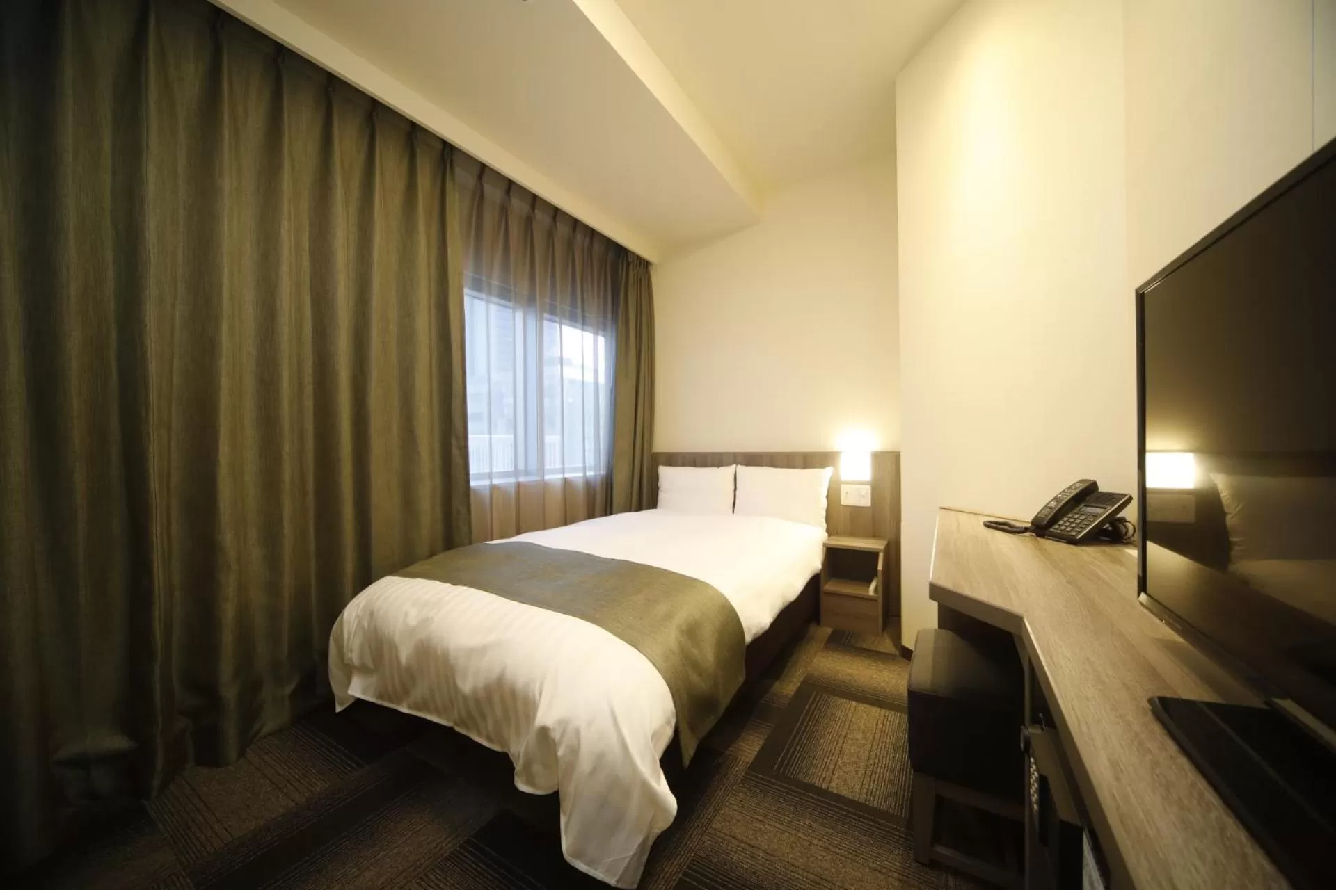 Bed in Dormy Inn Korakuen