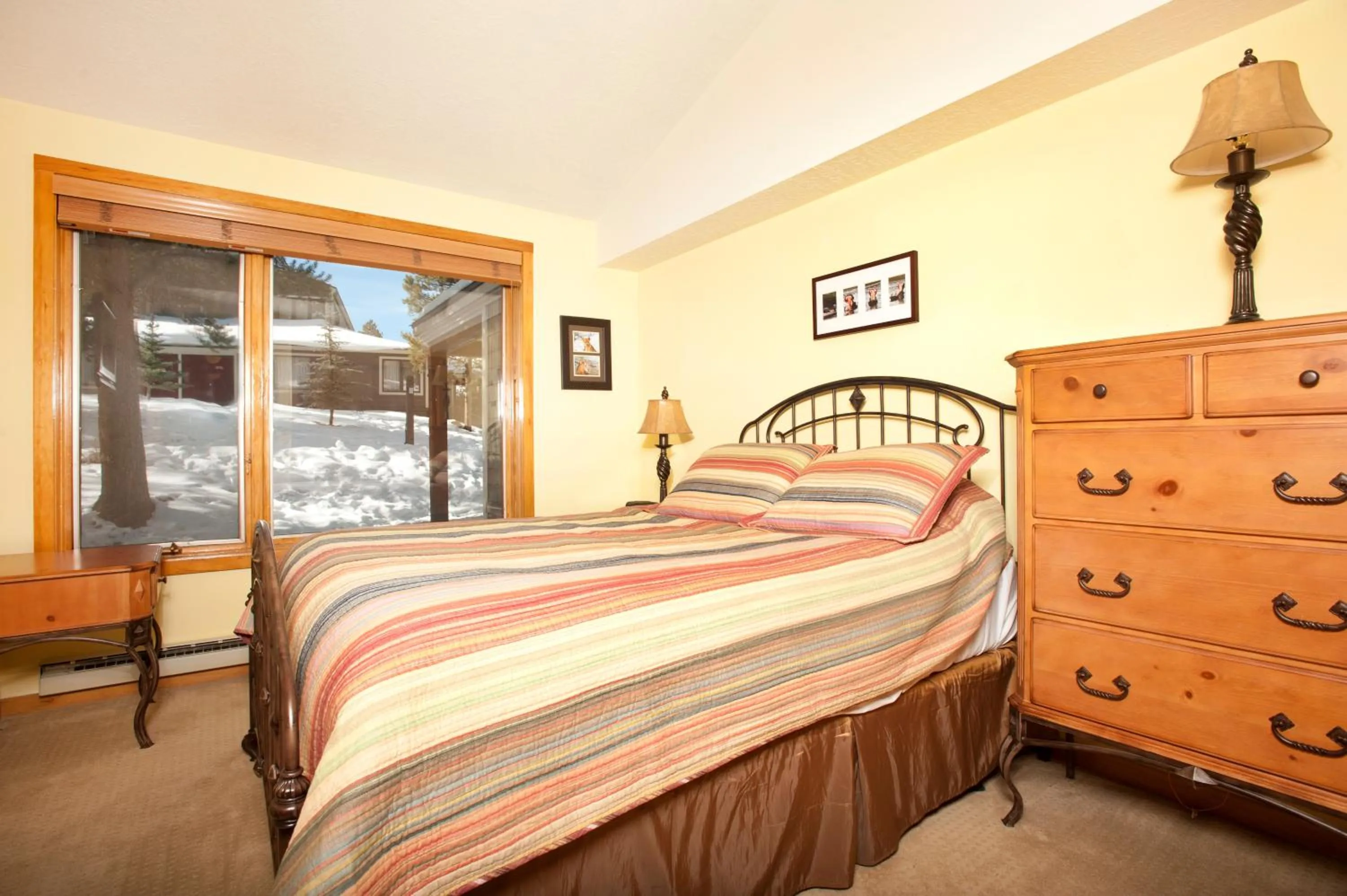 Bed in Evergreen Condominiums by Vail Resorts