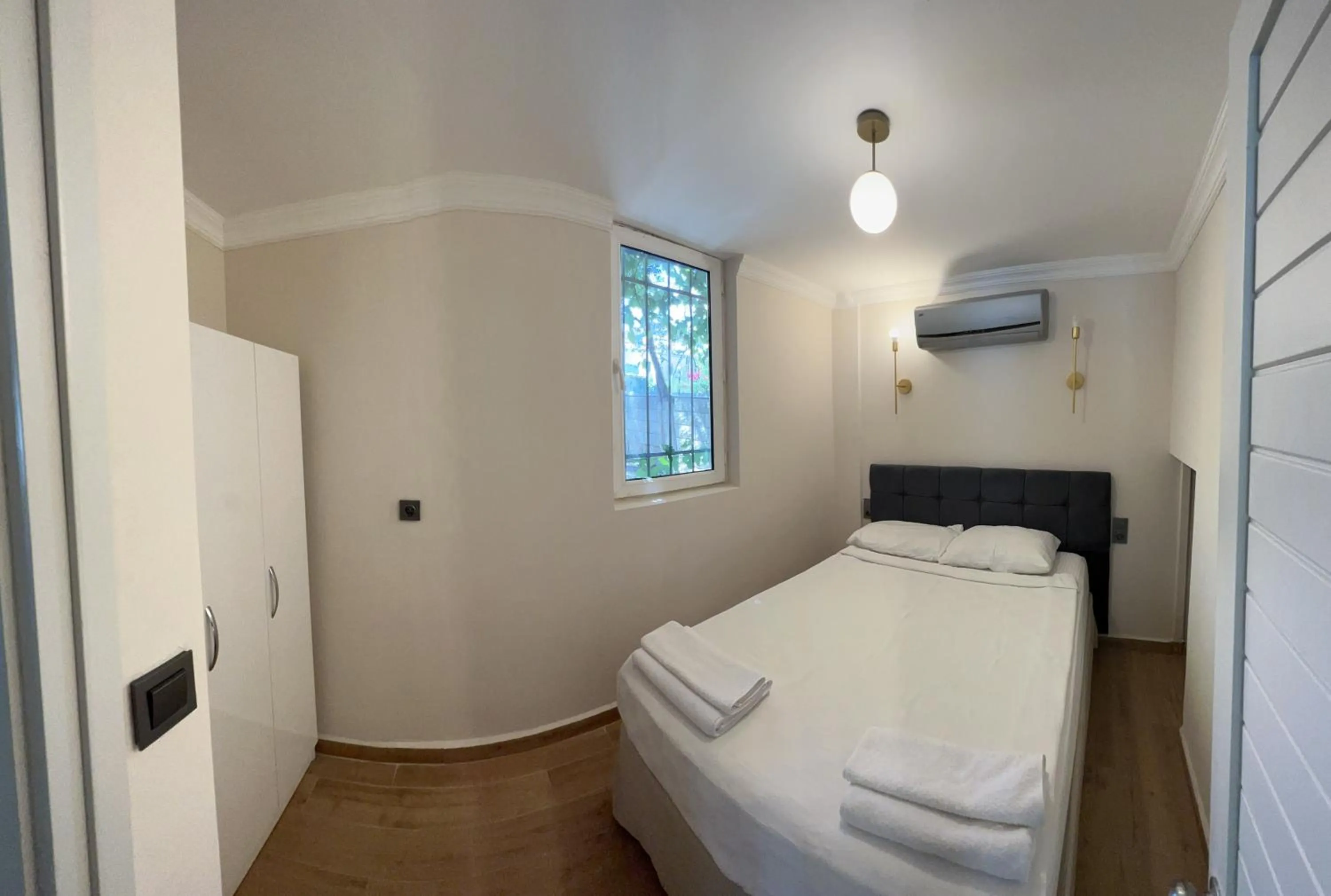 Bed in Moonshine Hotel & Suites