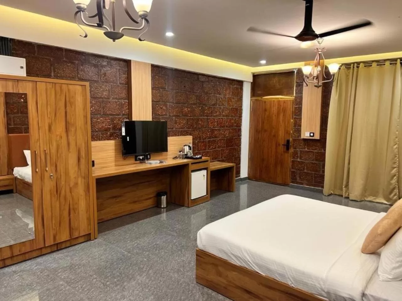 Bed, TV/Entertainment Center in Udaya Resort