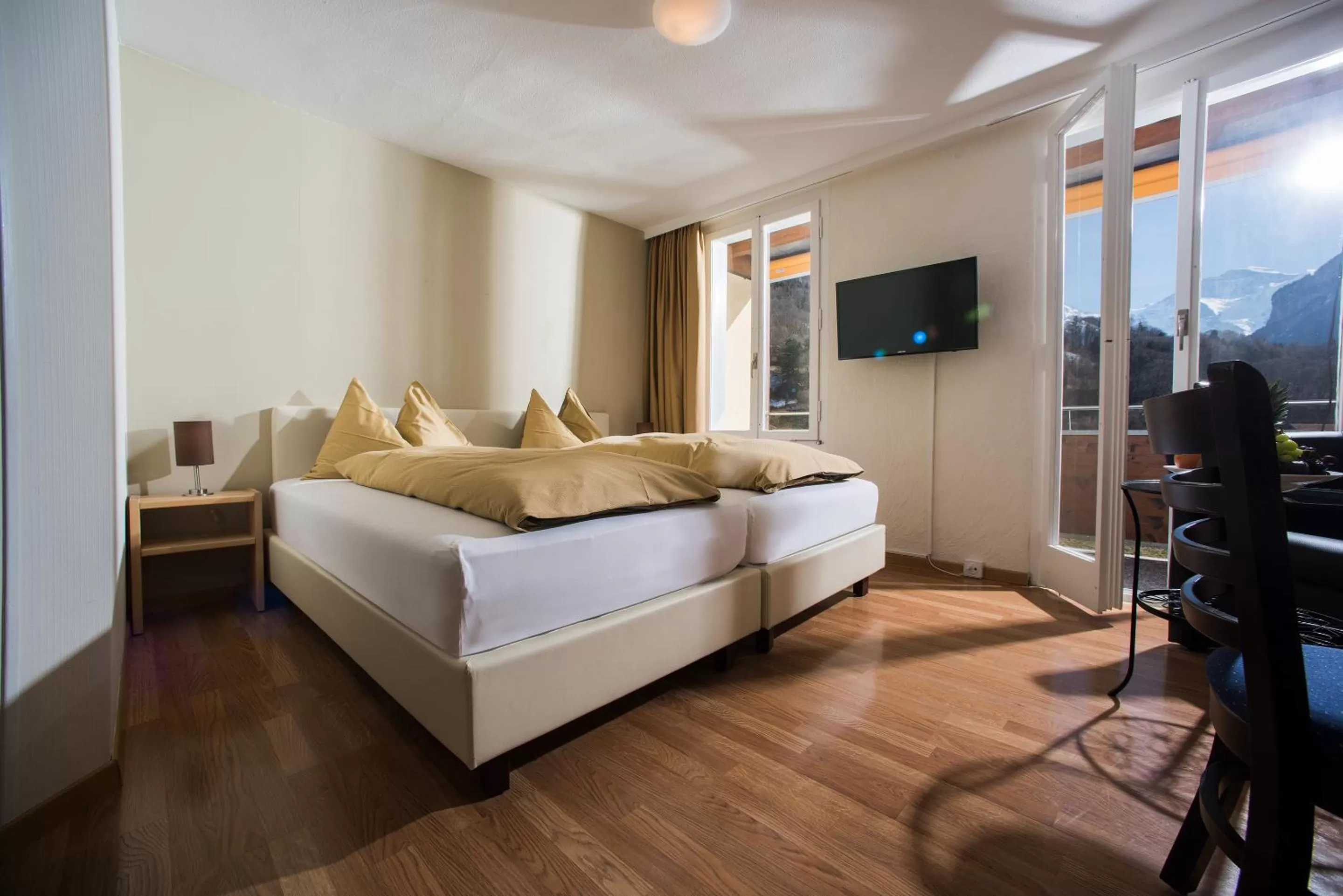 Landmark view, Bed in Jungfrau Hotel