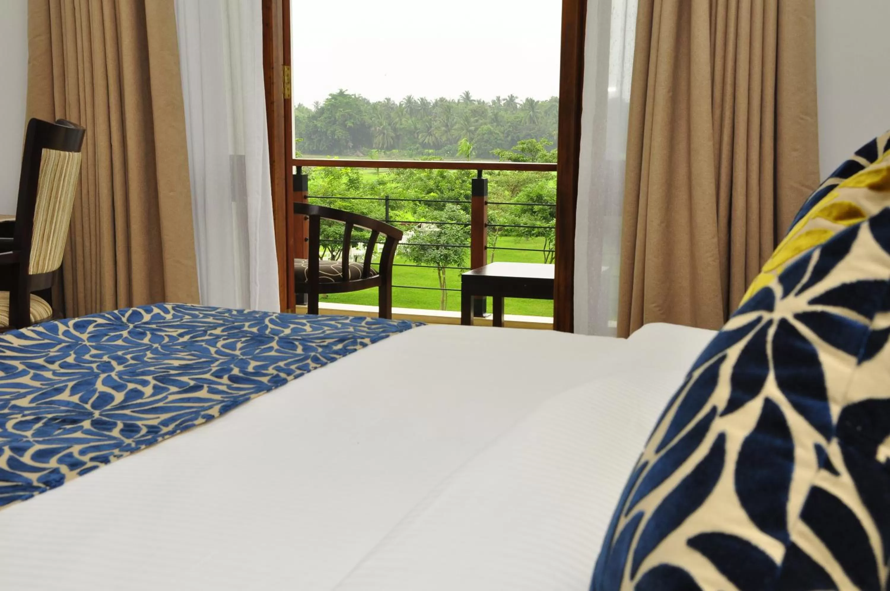 Garden view, Bed in Ruins Chaaya Hotel