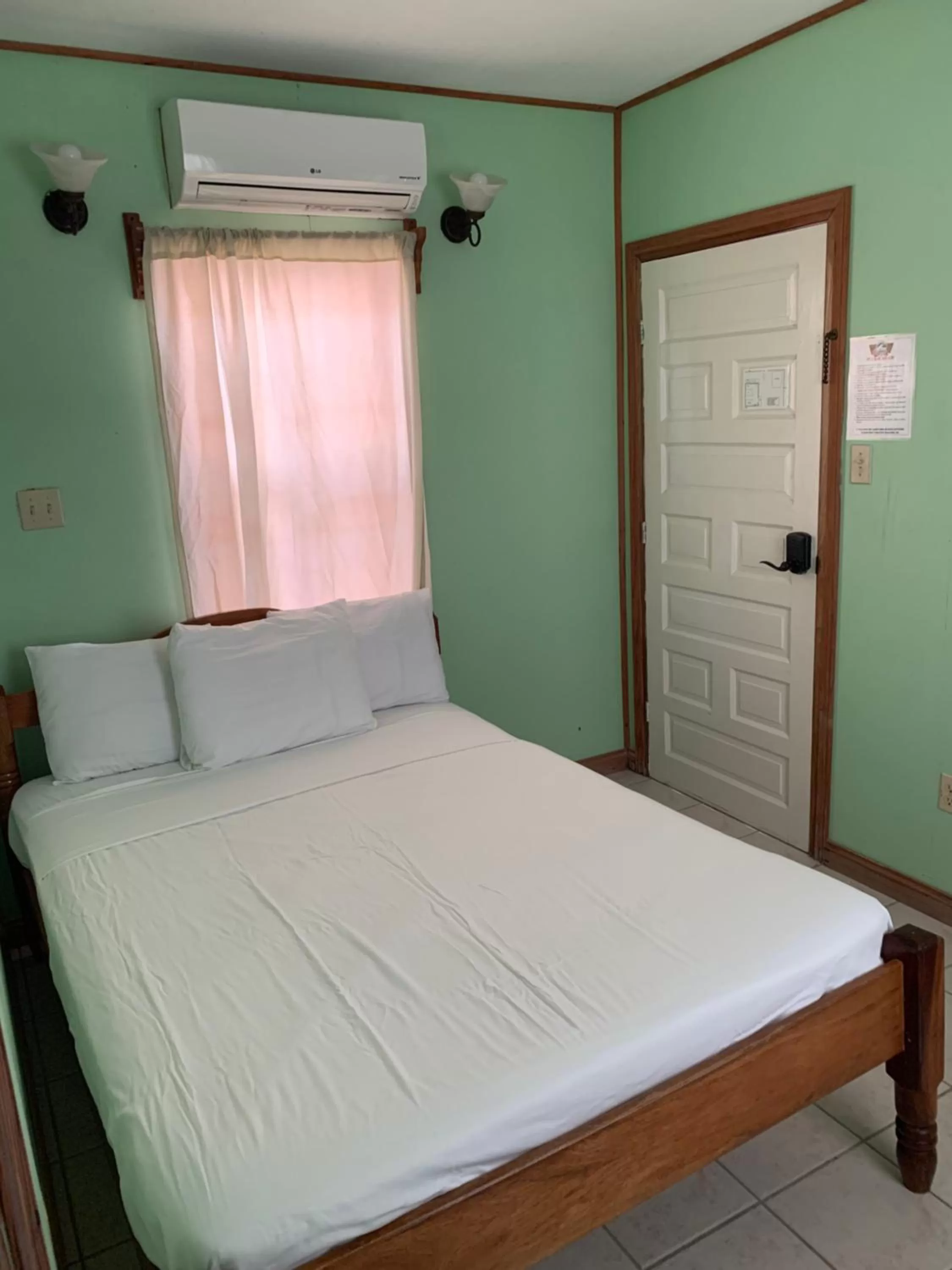 Bed in Blue Wave Guest House