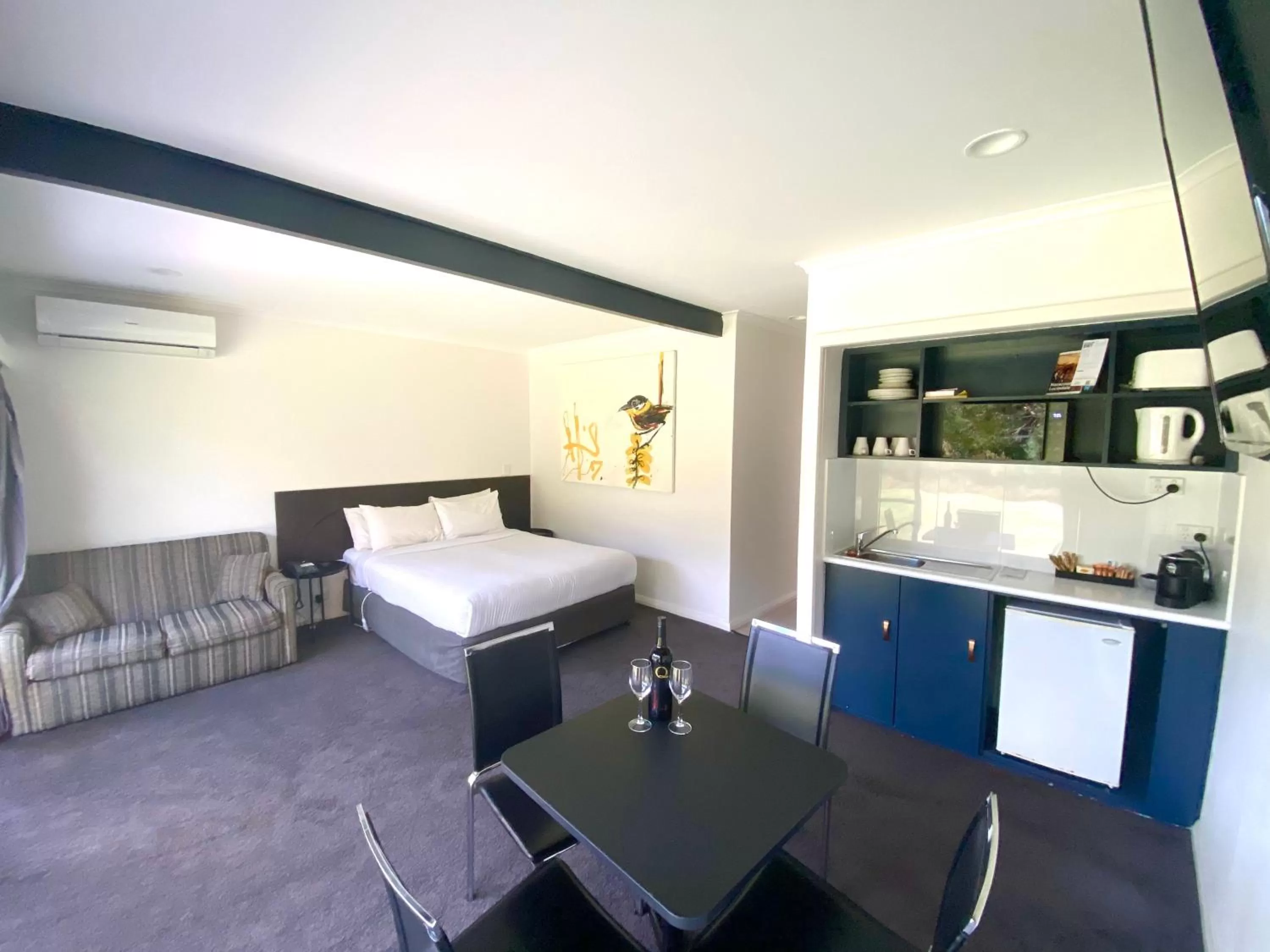 Bed in William Macintosh Motor Lodge