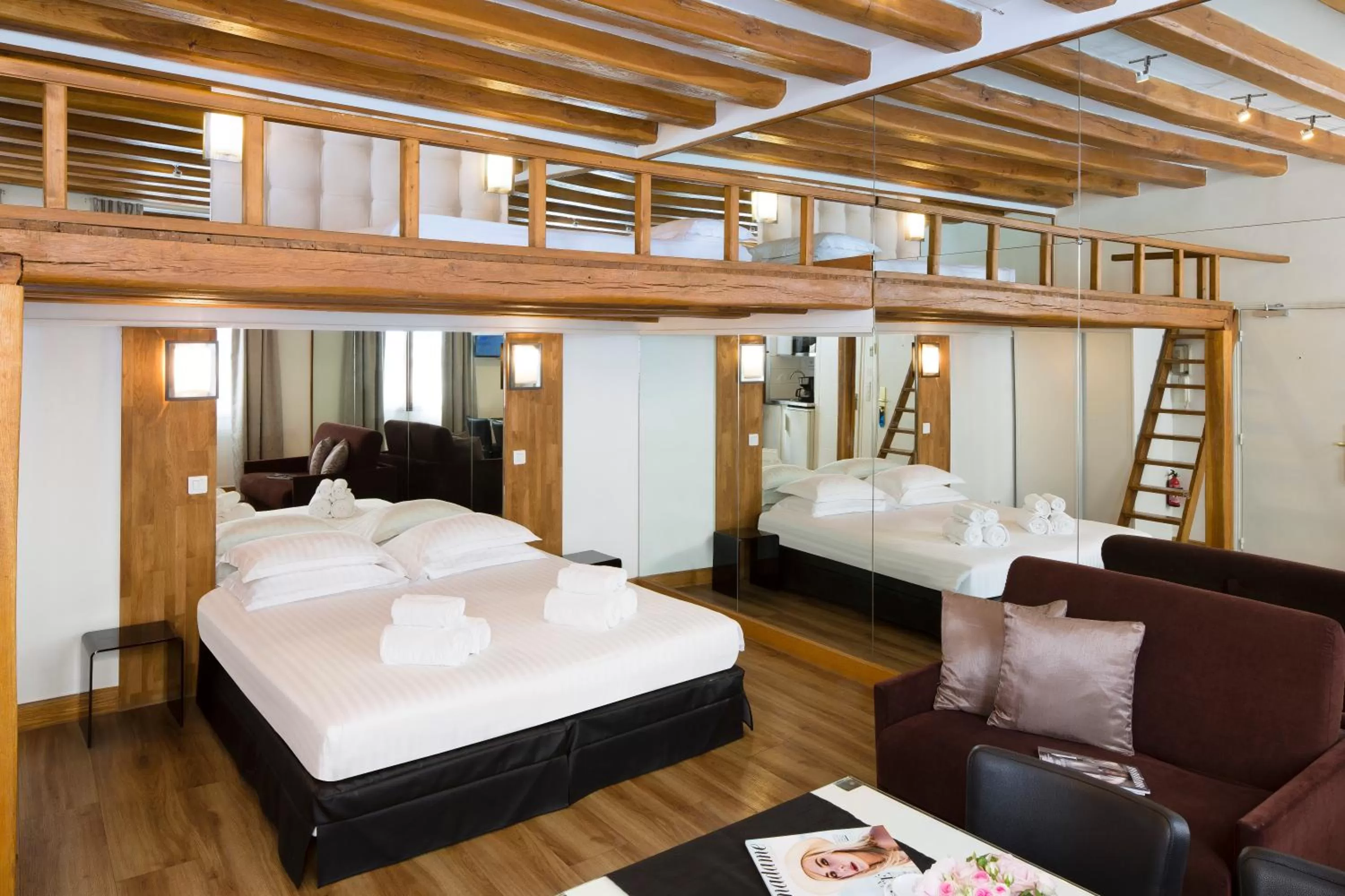 Bed in Lion d'Or Paris Hotel