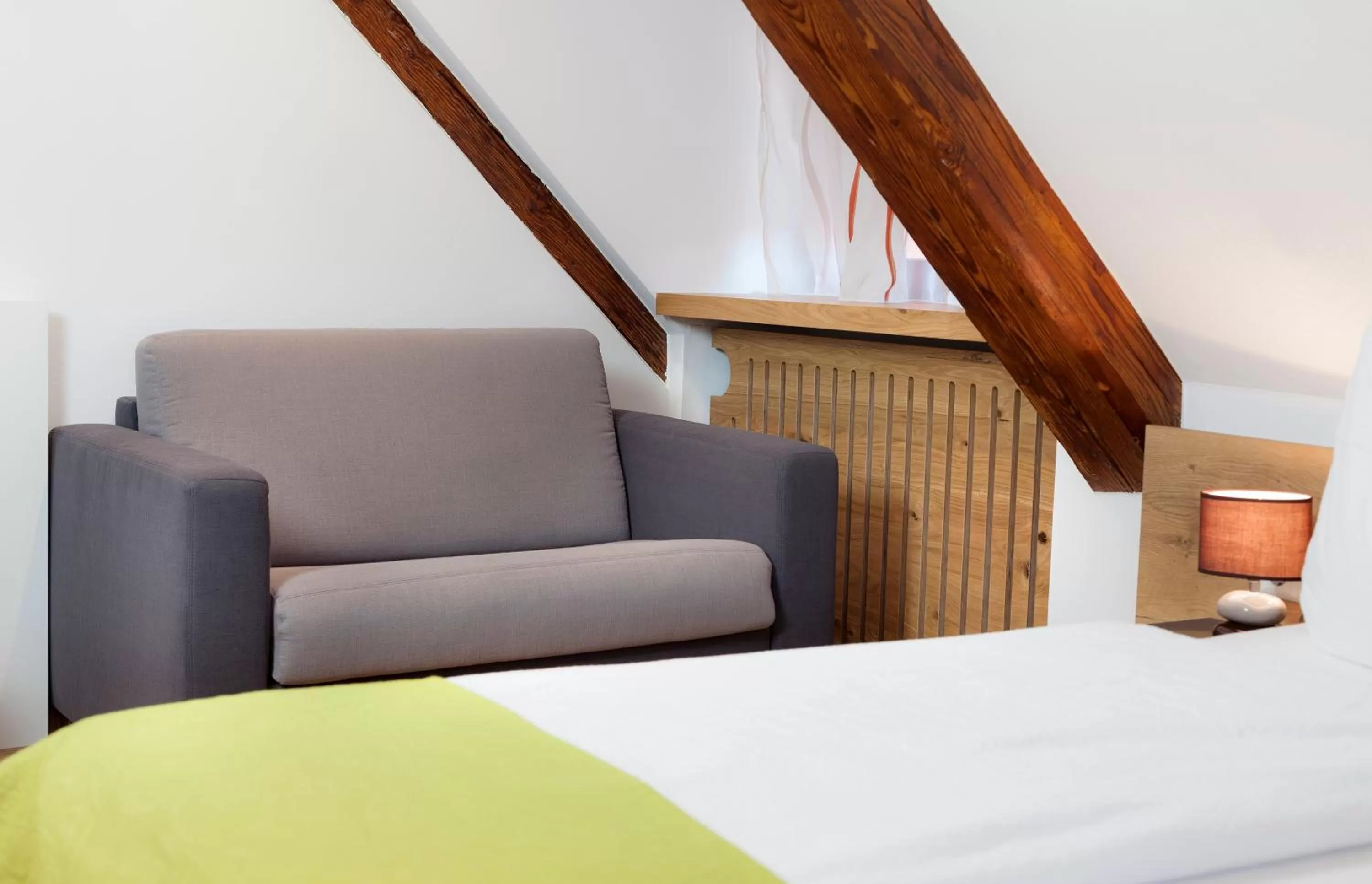 Bed, Seating Area in Torstuben