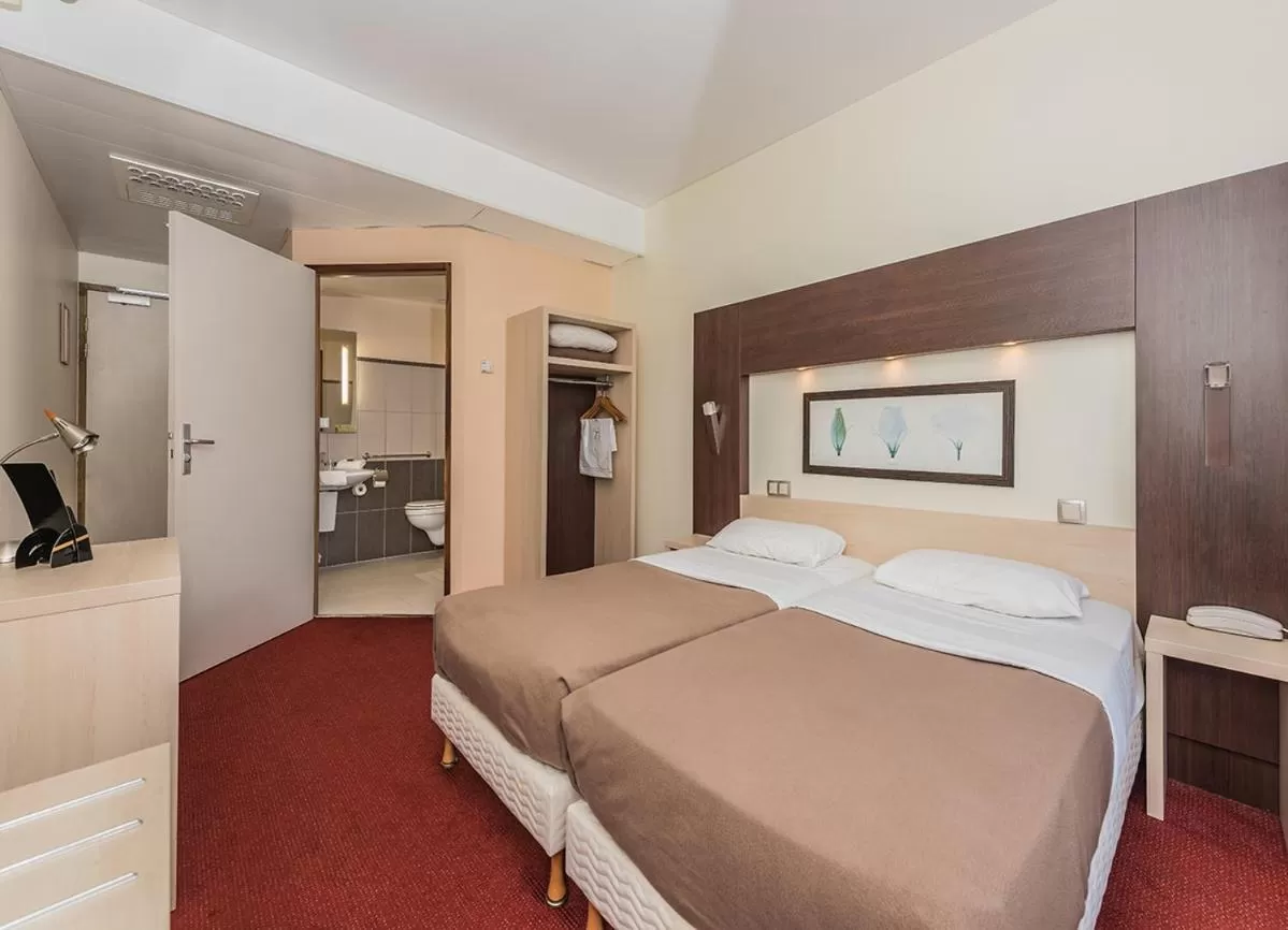 Decorative detail, Bed in Hostellerie Saint Vincent Beauvais Aeroport