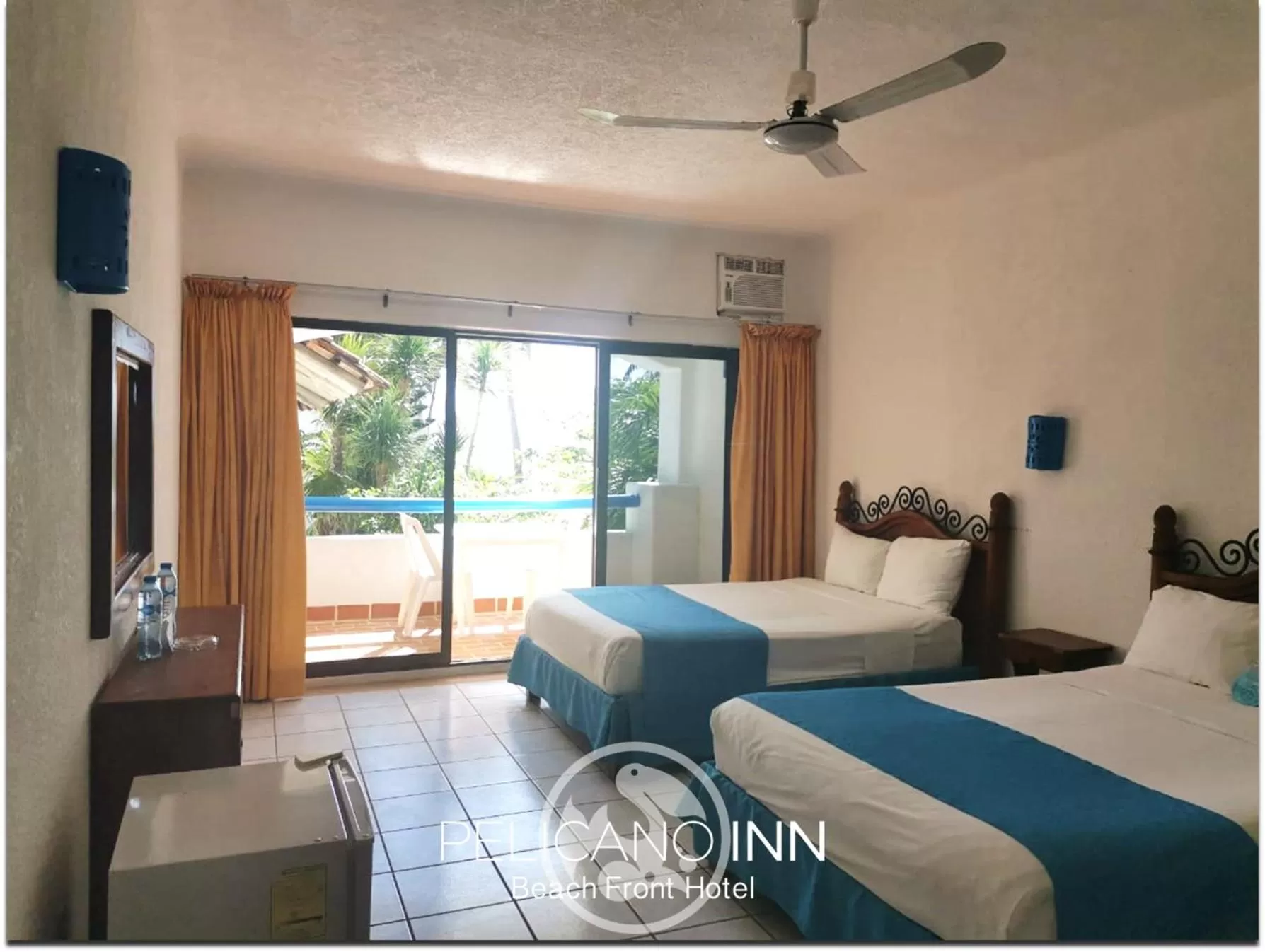 Photo of the whole room, Bed in Pelicano Inn Playa del Carmen - Beachfront Hotel