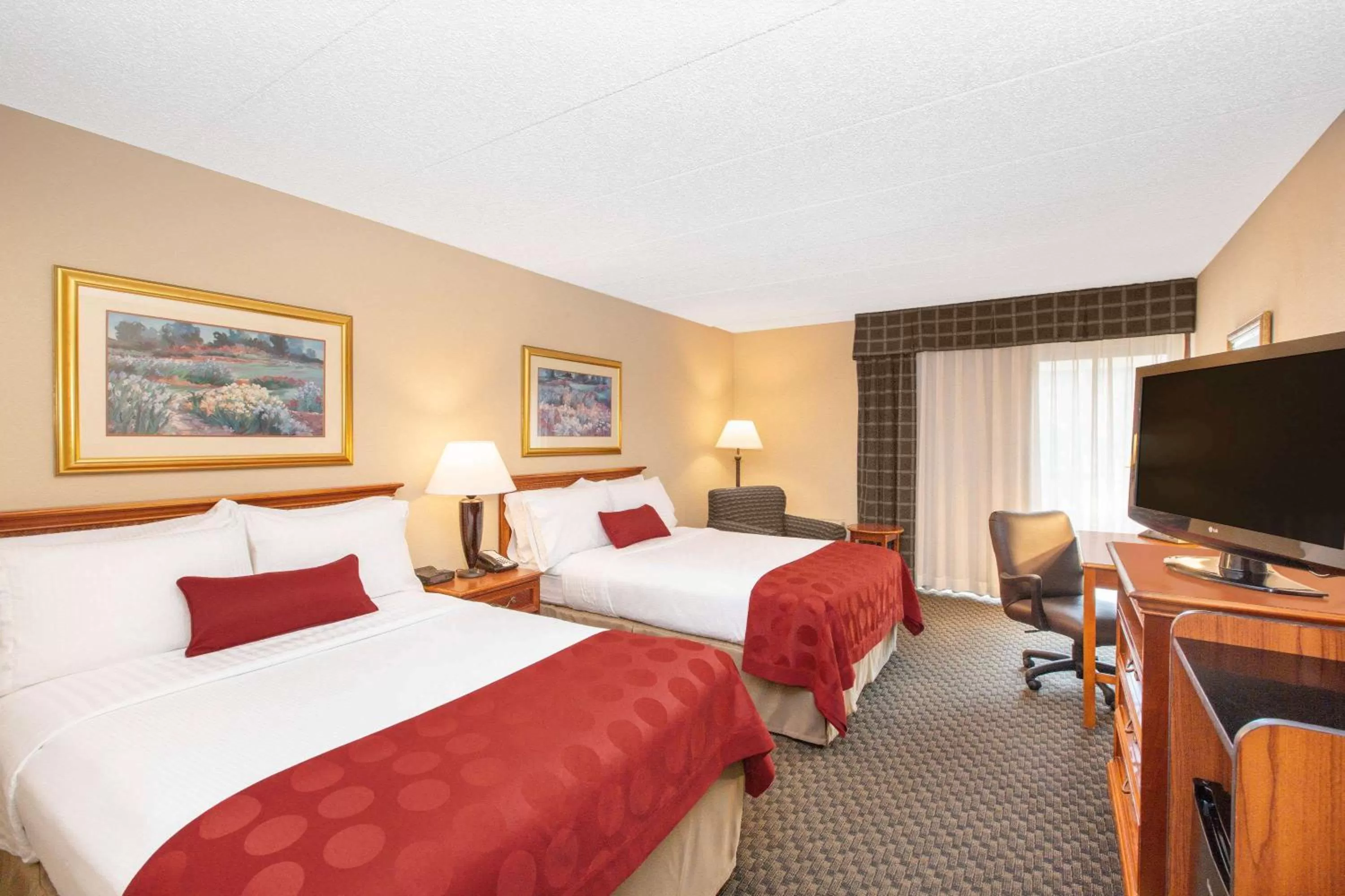 Photo of the whole room, Bed in Ramada by Wyndham Midtown Grand Island