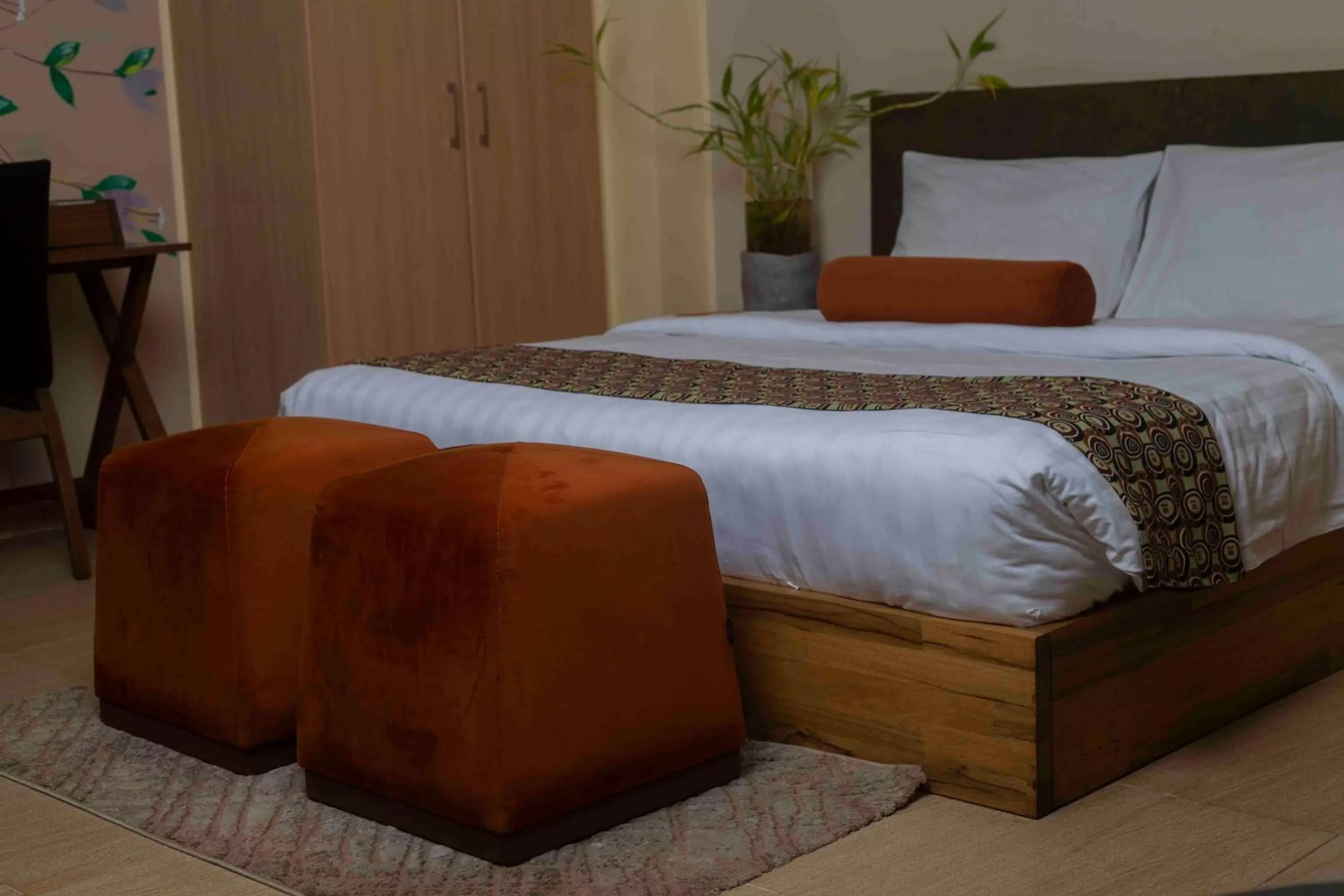 Bed in Roots Hotel Apartment