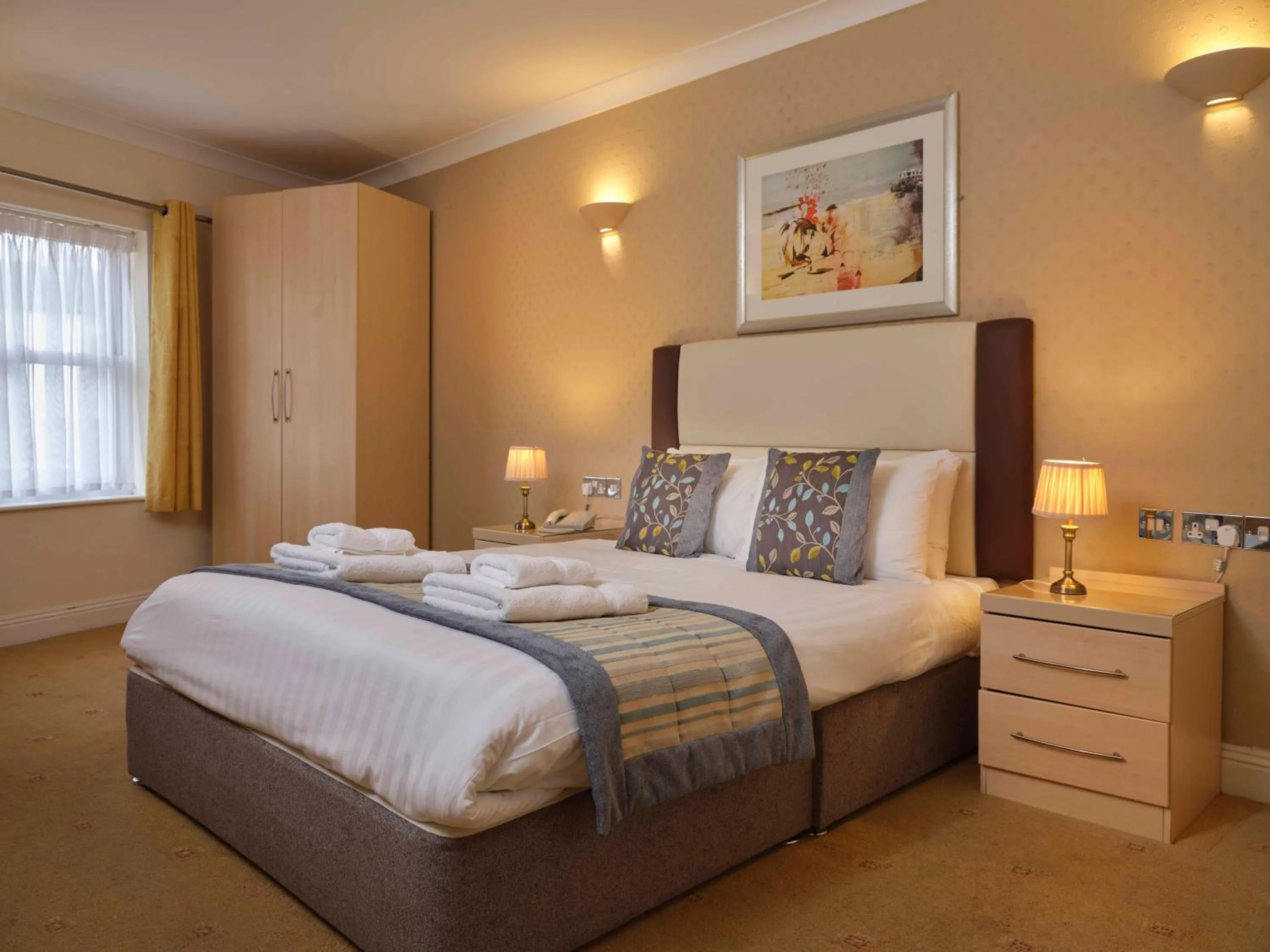 Bed in Royal Beacon Hotel