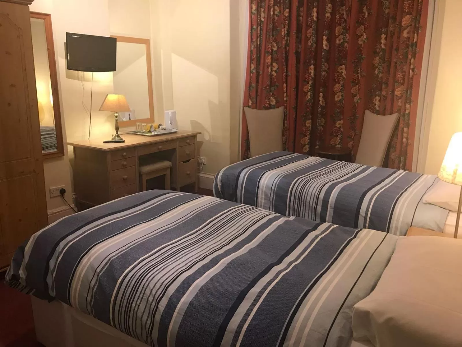 Bed in Ambassador Hotel